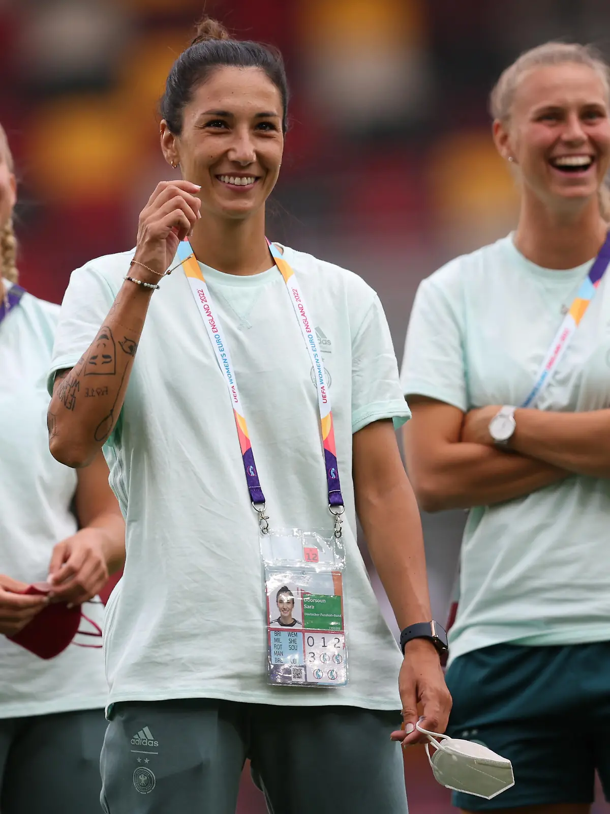 BRENTFORD, ENGLAND - JULY 12: Giulia Gwinn, Sara Doorsoun and Klara Buehl (L-R) of Germany look on prior to the UEFA Women's Euro England 2022 group B match between Germany and Spain at Brentford Community Stadium on July 12, 2022 in Brentford, England. (Photo by Maja Hitij/Getty Images for DFB)
