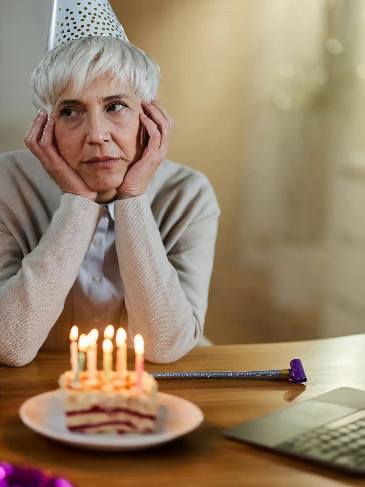 Depressed senior woman feeling lonely on her Birthday at home.