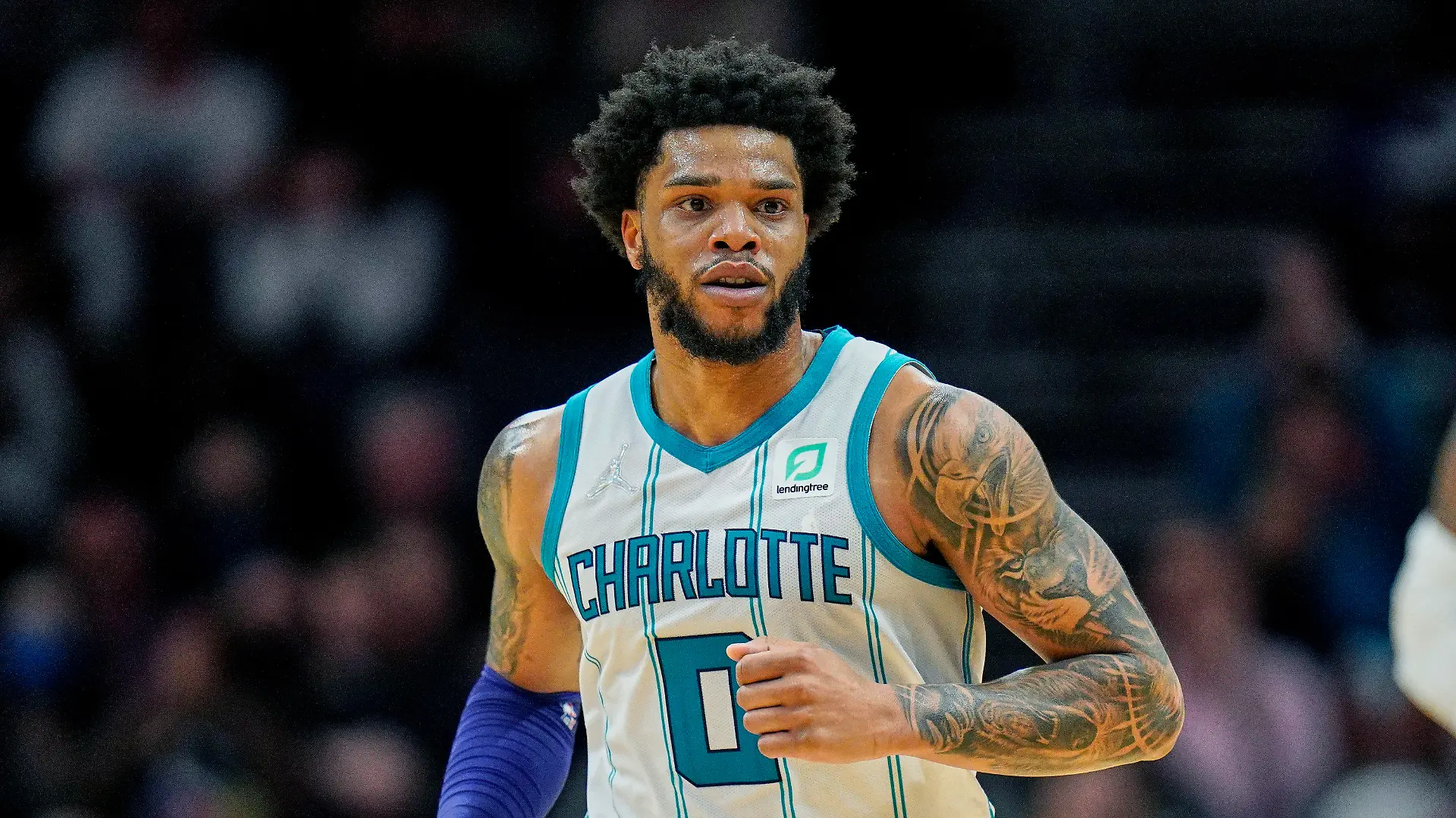 FILE - Charlotte Hornets forward Miles Bridges (0) moves up court during an NBA basketball game against the Denver Nuggets on Monday, March 28, 2022, in Charlotte, N.C. Hornets forward Miles Bridges was arrested Wednesday, June 29, 2022, in Los Angeles after a warrant was issued, according to the Los Angeles Police Department. The details of the arrest and the charges were not immediately available. (AP Photo/Rusty Jones, File)