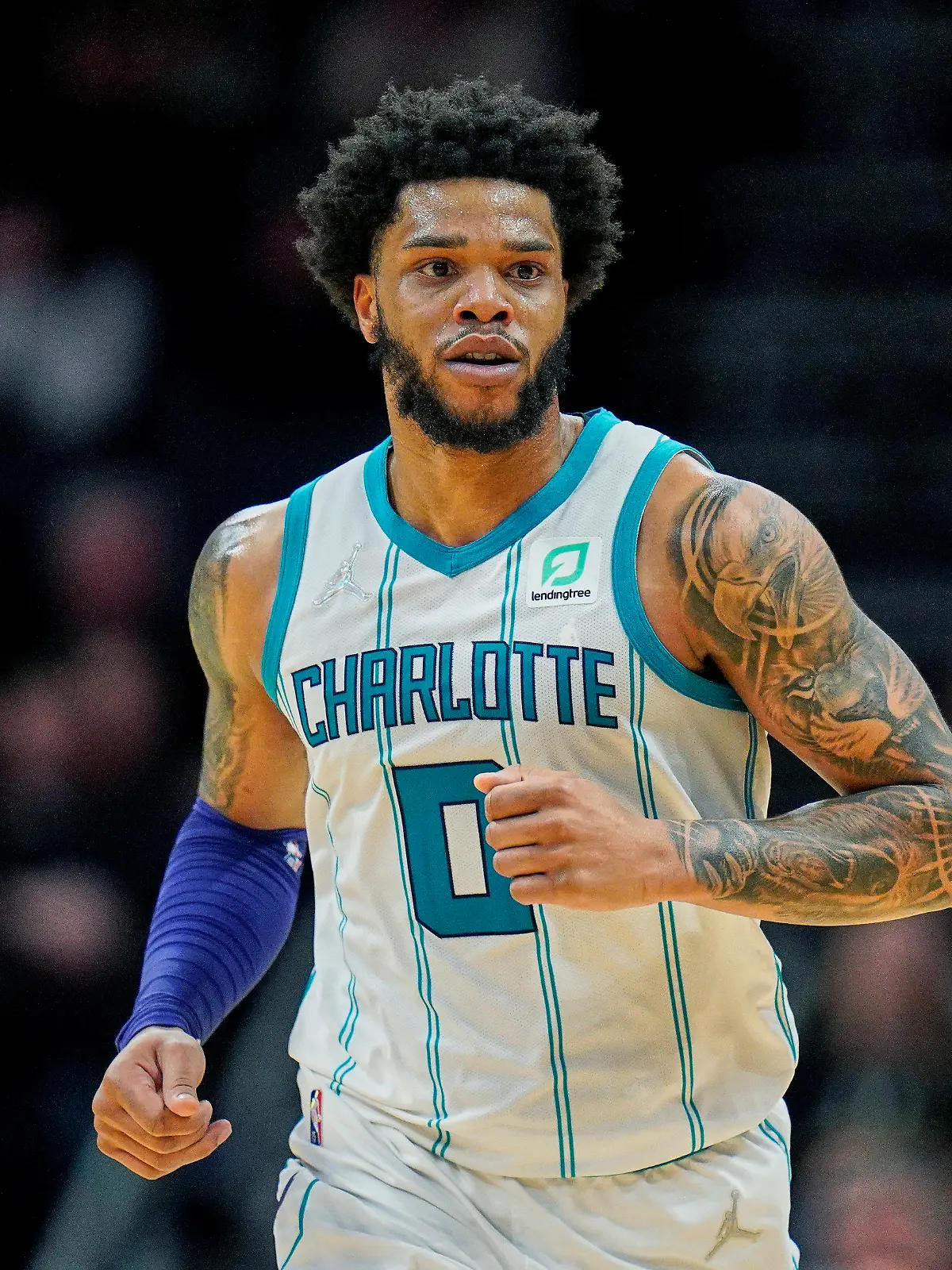 FILE - Charlotte Hornets forward Miles Bridges (0) moves up court during an NBA basketball game against the Denver Nuggets on Monday, March 28, 2022, in Charlotte, N.C. Hornets forward Miles Bridges was arrested Wednesday, June 29, 2022, in Los Angeles after a warrant was issued, according to the Los Angeles Police Department. The details of the arrest and the charges were not immediately available. (AP Photo/Rusty Jones, File)