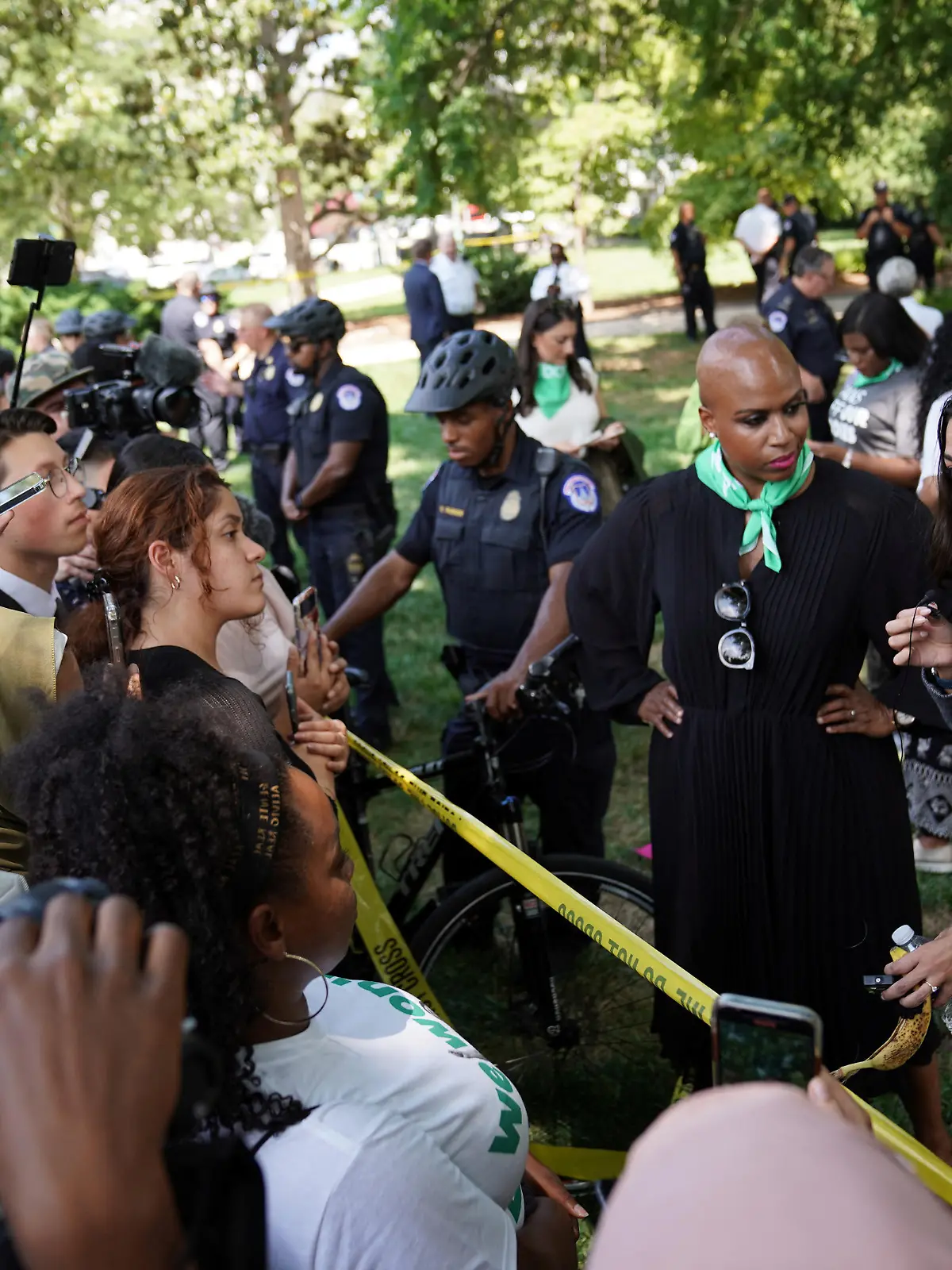 Representatives Ayanna Pressley (D-MA) and Alexandria Ocasio-Cortez (D-NY) speak to the press while detained for their part in an abortion rights protest outside of the U.S. Supreme Court in Washington, D.C., U.S., July 19, 2022. REUTERS/Sarah Silbiger