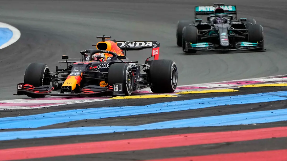 Red Bull driver Max Verstappen, left, leads next to Mercedes driver Lewis Hamilton of Britain during the French Formula One Grand Prix at the Paul Ricard racetrack in Le Castellet, southern France, Sunday, June 20, 2021. (AP Photo/Francois Mori)