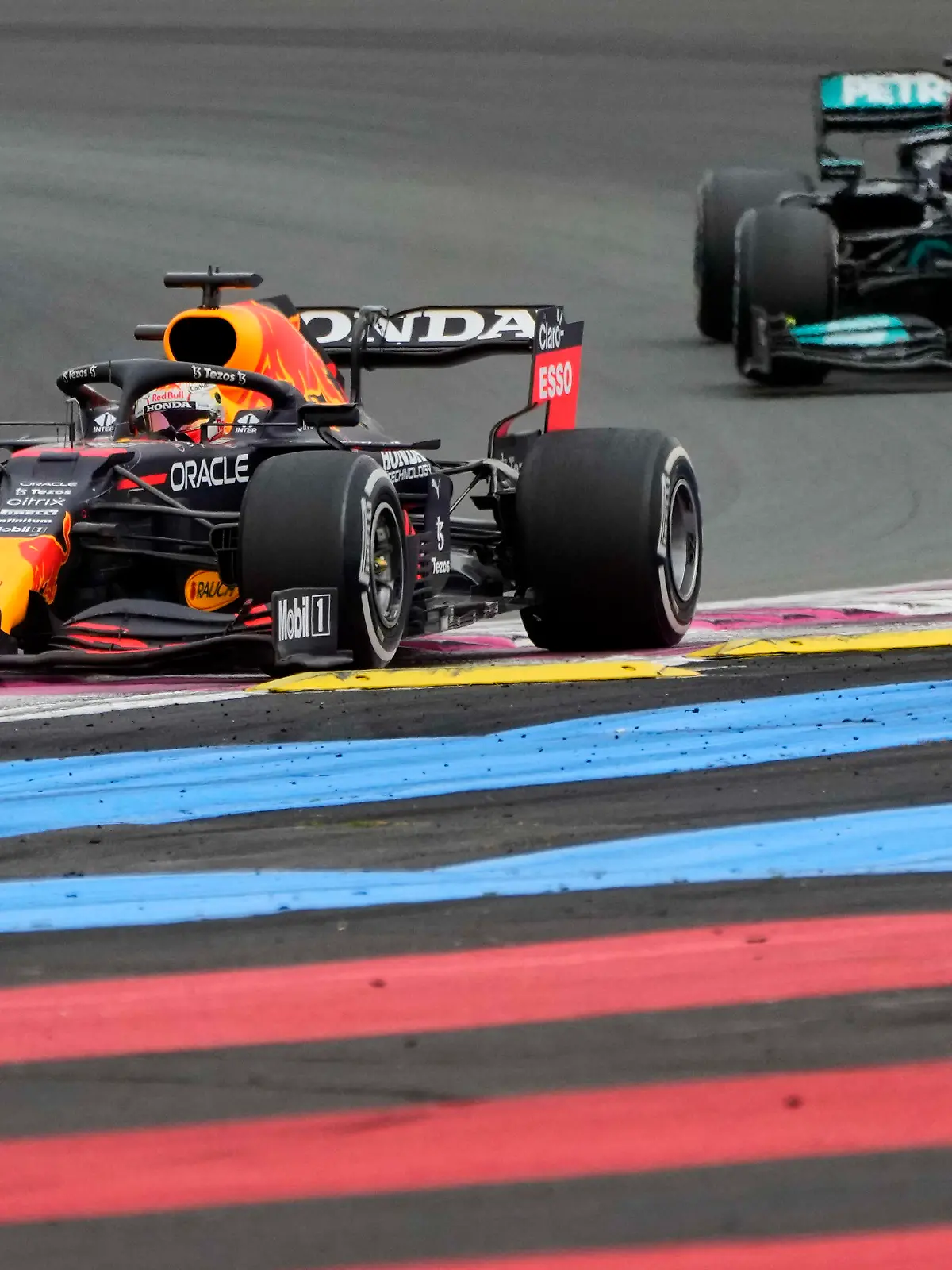 Red Bull driver Max Verstappen, left, leads next to Mercedes driver Lewis Hamilton of Britain during the French Formula One Grand Prix at the Paul Ricard racetrack in Le Castellet, southern France, Sunday, June 20, 2021. (AP Photo/Francois Mori)