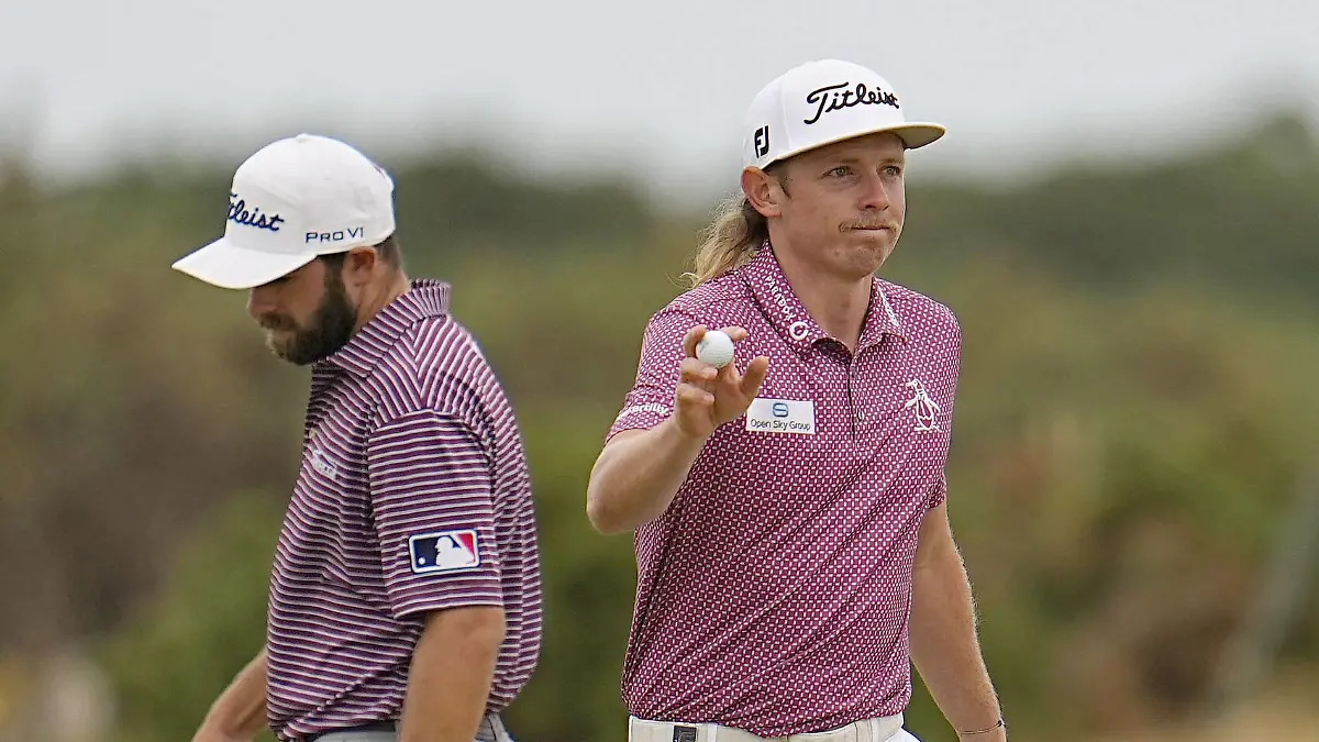  Golf: British Open Cameron Smith R of Australia reacts after making a birdie putt on the 10th hole during the final round of the British Open golf championship on July 17, 2022, on the Old Course at St. Andrews, Scotland. Cameron Young of the United States can be seen behind him. PUBLICATIONxINxGERxSUIxAUTxHUNxONLY A14AA0001316078P