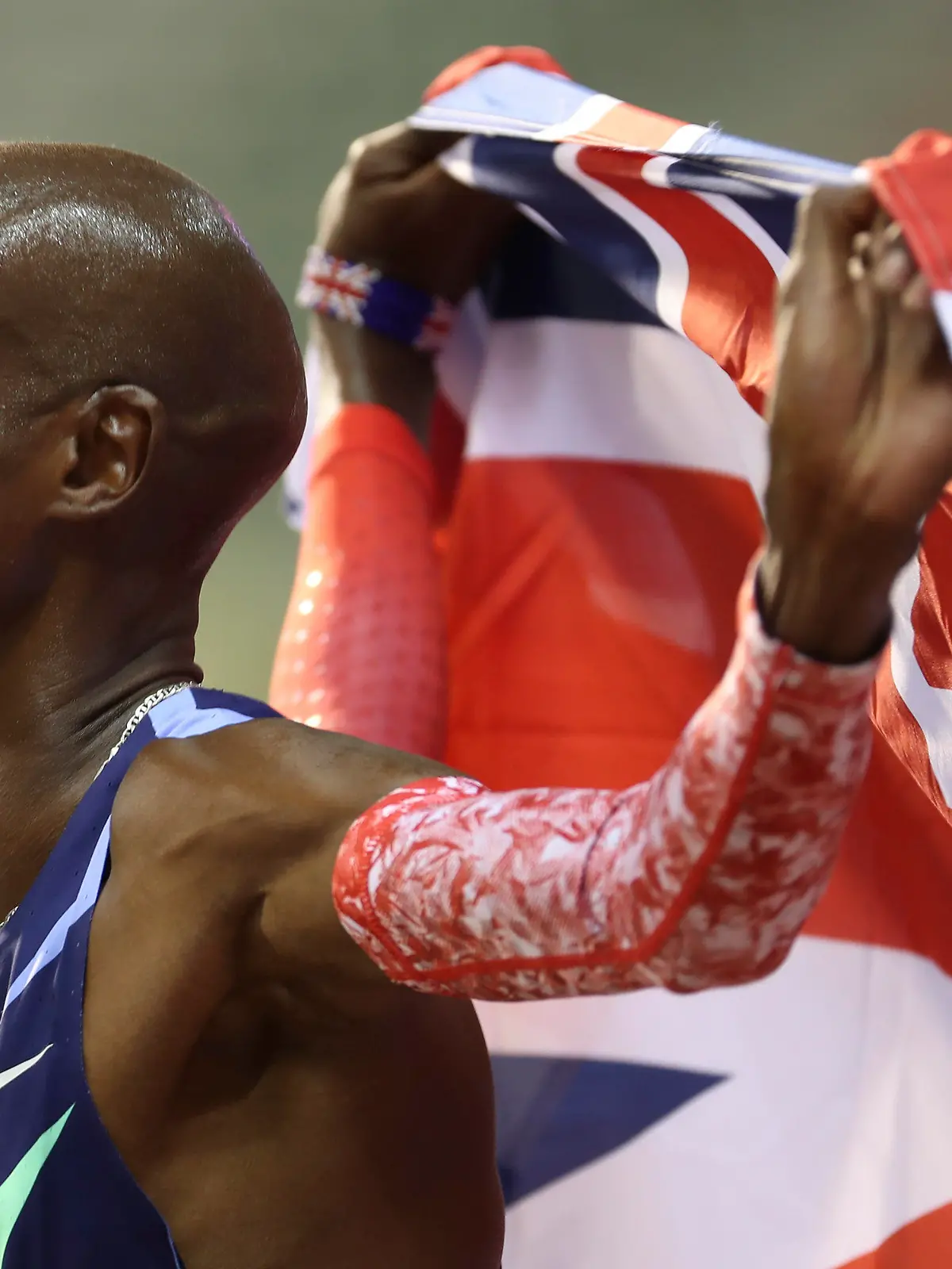 FILE - Britain's Mo Farah celebrates after winning the One Hour Men's race, at the Diamond League Memorial Van Damme athletics event where he set a new world record, at the King Baudouin stadium in Brussels on Friday, Sept. 4, 2020. It is hard to be first. Mo Farah this week went from being a gold medal-winning runner to the most prominent person ever to come forward as a victim of people trafficking. The four-time Olympic champion’s decision to tell the story of how he was exploited as a child gives a face to the often faceless victims of modern slavery, highlighting a crime that is often conflated with illegal immigration.  (AP Photo/Francisco Seco, File)