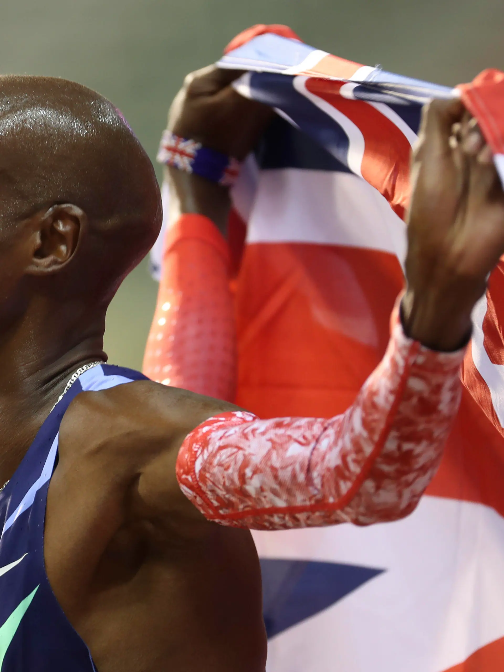 FILE - Britain's Mo Farah celebrates after winning the One Hour Men's race, at the Diamond League Memorial Van Damme athletics event where he set a new world record, at the King Baudouin stadium in Brussels on Friday, Sept. 4, 2020. It is hard to be first. Mo Farah this week went from being a gold medal-winning runner to the most prominent person ever to come forward as a victim of people trafficking. The four-time Olympic champion’s decision to tell the story of how he was exploited as a child gives a face to the often faceless victims of modern slavery, highlighting a crime that is often conflated with illegal immigration.  (AP Photo/Francisco Seco, File)