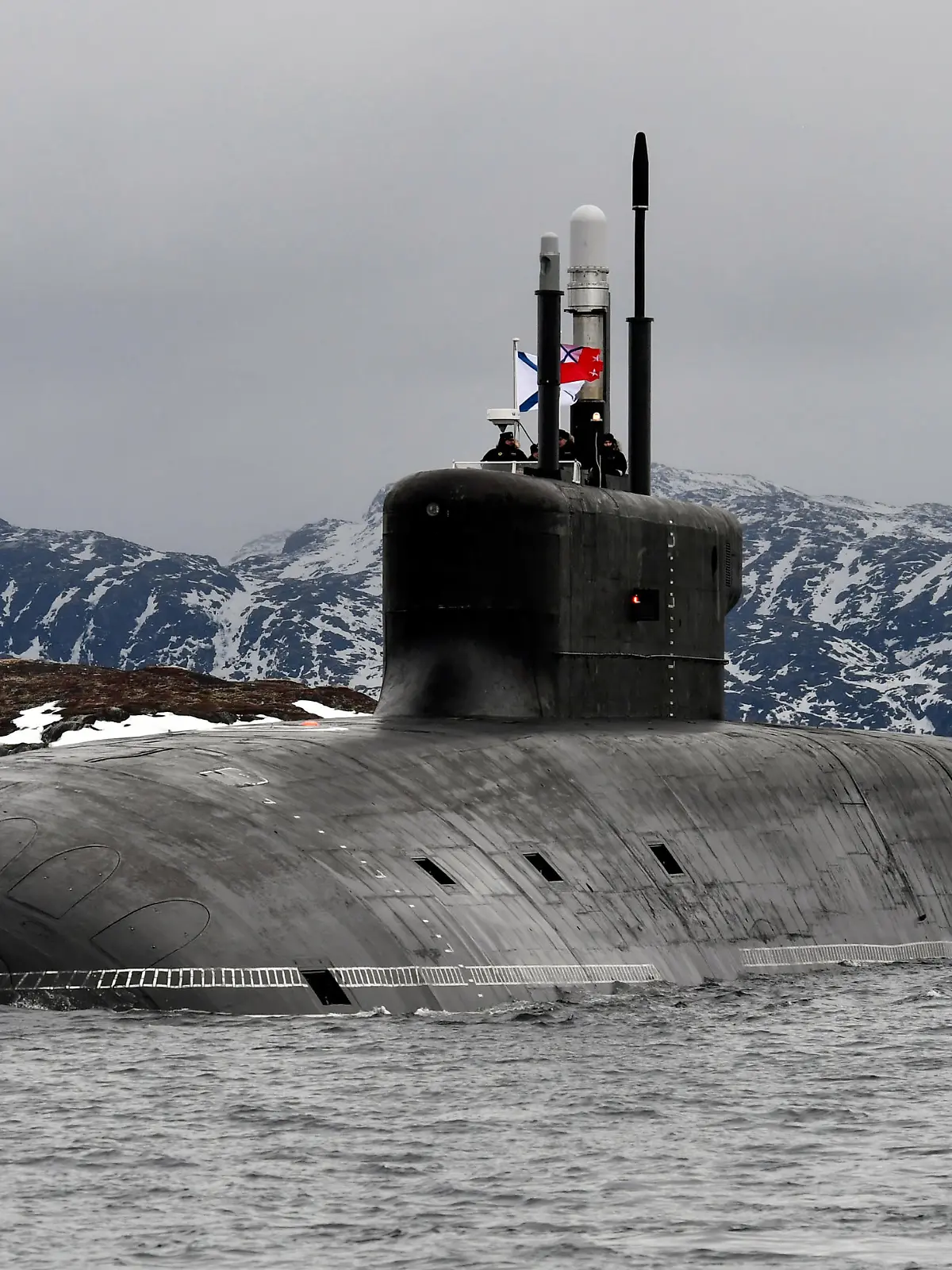 MURMANSK REGION, RUSSIA - MARCH 31, 2021: The Russian Navy nuclear-powered ballistic missile submarine Knyaz Vladimir enters Kola Bay off Russia's Barents Sea coast after taking part in an expedition to the Arctic Ocean. The Knyaz Vladimir submarine was laid down at Sevmash on 30 July 2012. It was built according to the upgraded Borei-A Project (Project 955A) and belongs to the fourth generation of nuclear-powered submarines built for the Russian Navy. Lev Fedoseyev/TASS