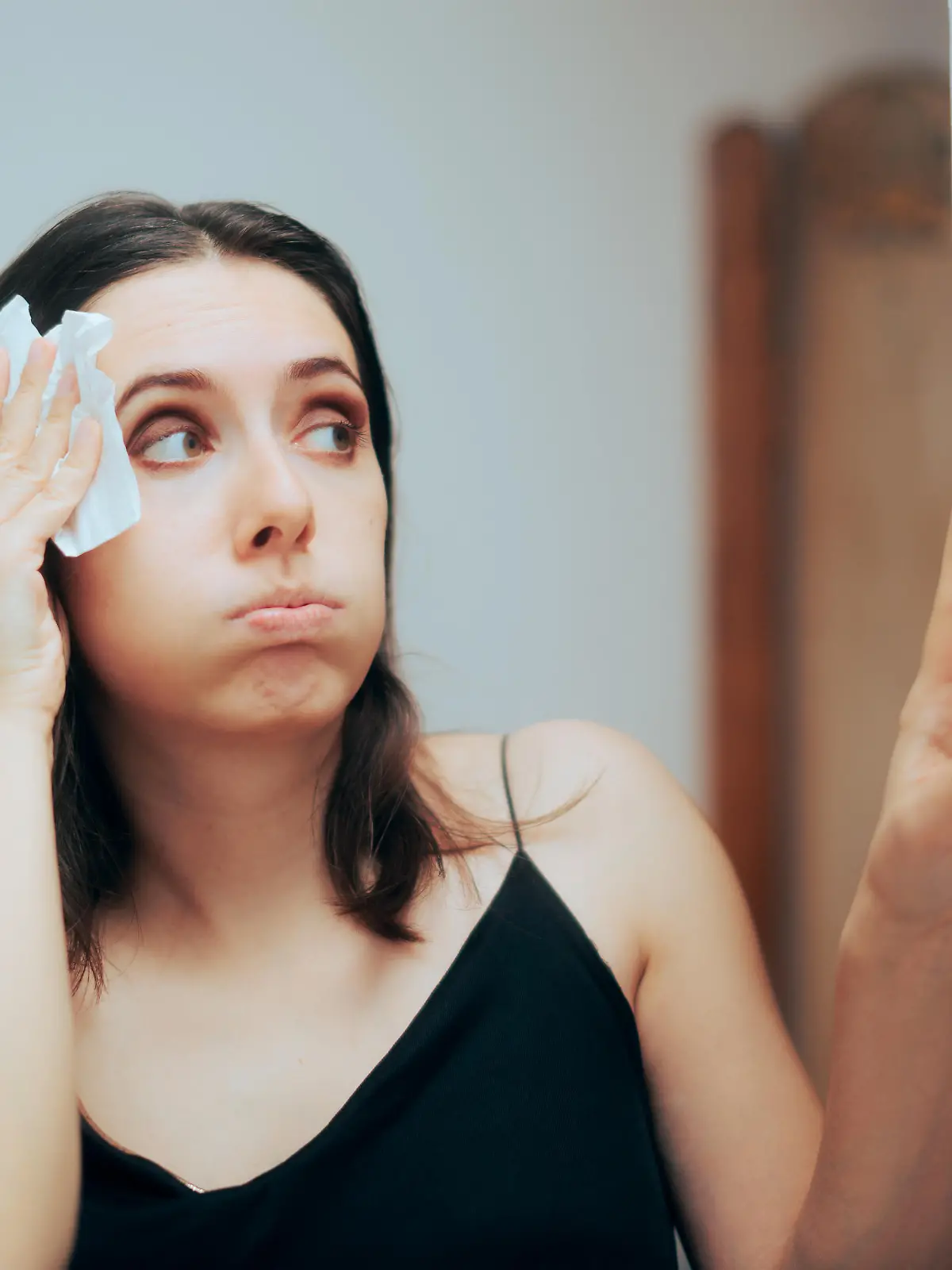Person adjusting temperature from the AC settings