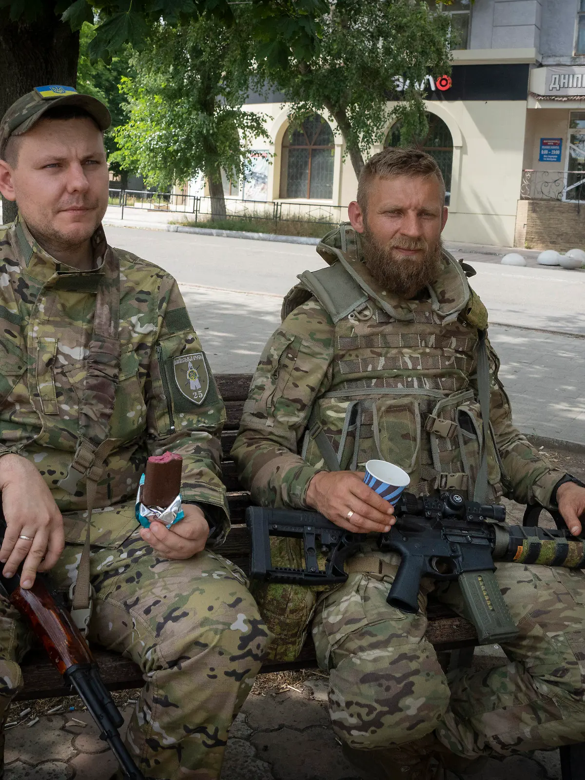 Ukrainian soldiers enjoy a short rest in Bakhmut, Donetsk region, Ukraine, Sunday, June 26, 2022. (AP Photo/Efrem Lukatsky)
