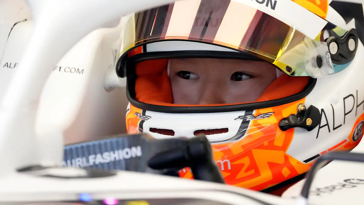 AlphaTauri driver Yuki Tsunoda of Japan waits on his car in the pit garage during the first free practice for the Austrian Formula One Grand Prix at the Red Bull Ring racetrack in Spielberg, Austria, Friday, July 8, 2022. The Austrian F1 Grand Prix will be held on Sunday July 10, 2022. (AP Photo/Matthias Schrader)