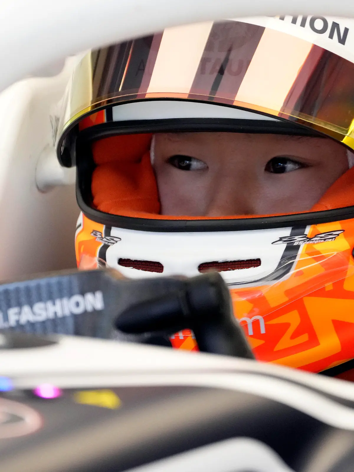 AlphaTauri driver Yuki Tsunoda of Japan waits on his car in the pit garage during the first free practice for the Austrian Formula One Grand Prix at the Red Bull Ring racetrack in Spielberg, Austria, Friday, July 8, 2022. The Austrian F1 Grand Prix will be held on Sunday July 10, 2022. (AP Photo/Matthias Schrader)