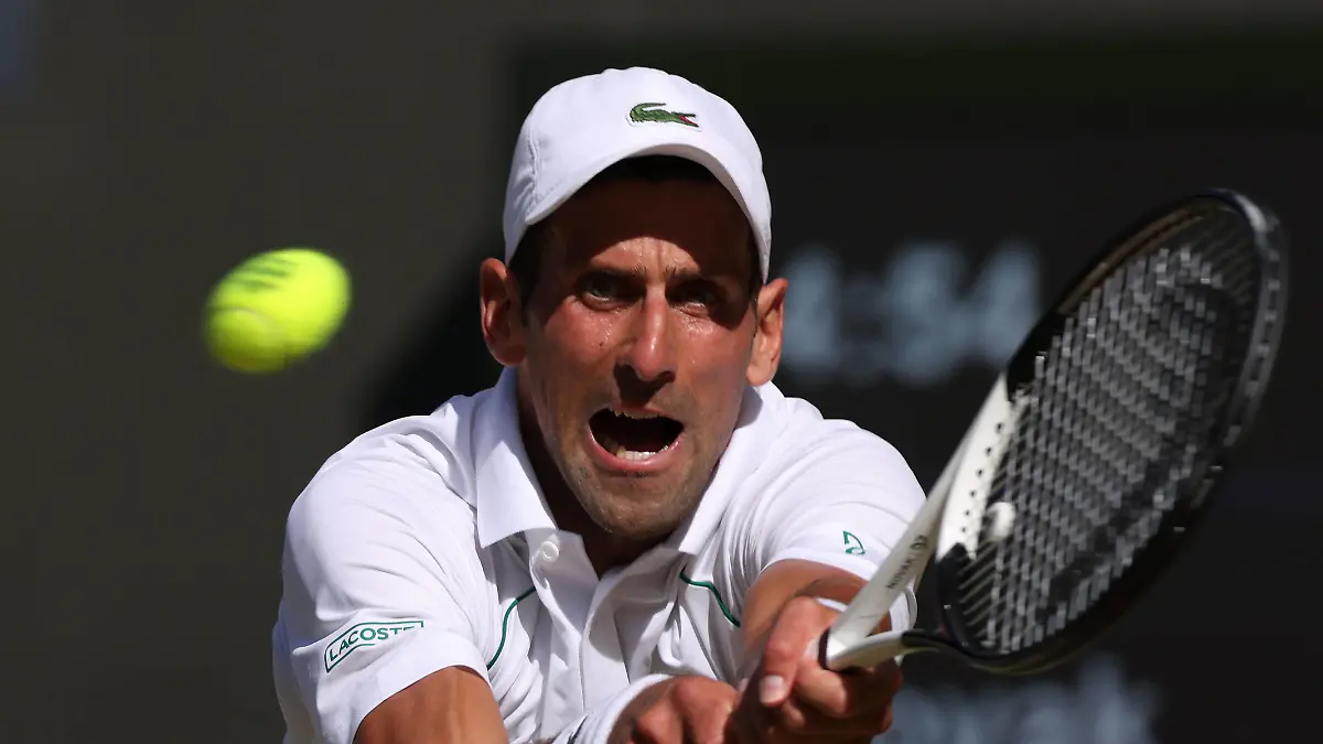 Serbian Novak Djokovic plays a backhand in his Semi-Final match against Great Britain's Cameron Norrie on day twelve of the 2022 Wimbledon championships in London on Friday, July 08, 2022. Djokovic won the match 2-6,6-3,6-2,6-4. Photo by Hugo Philpott/UPI Photo via Newscom/upiphotostwo871835/UPI/Newscom/SIPA/2207082140 / action press
