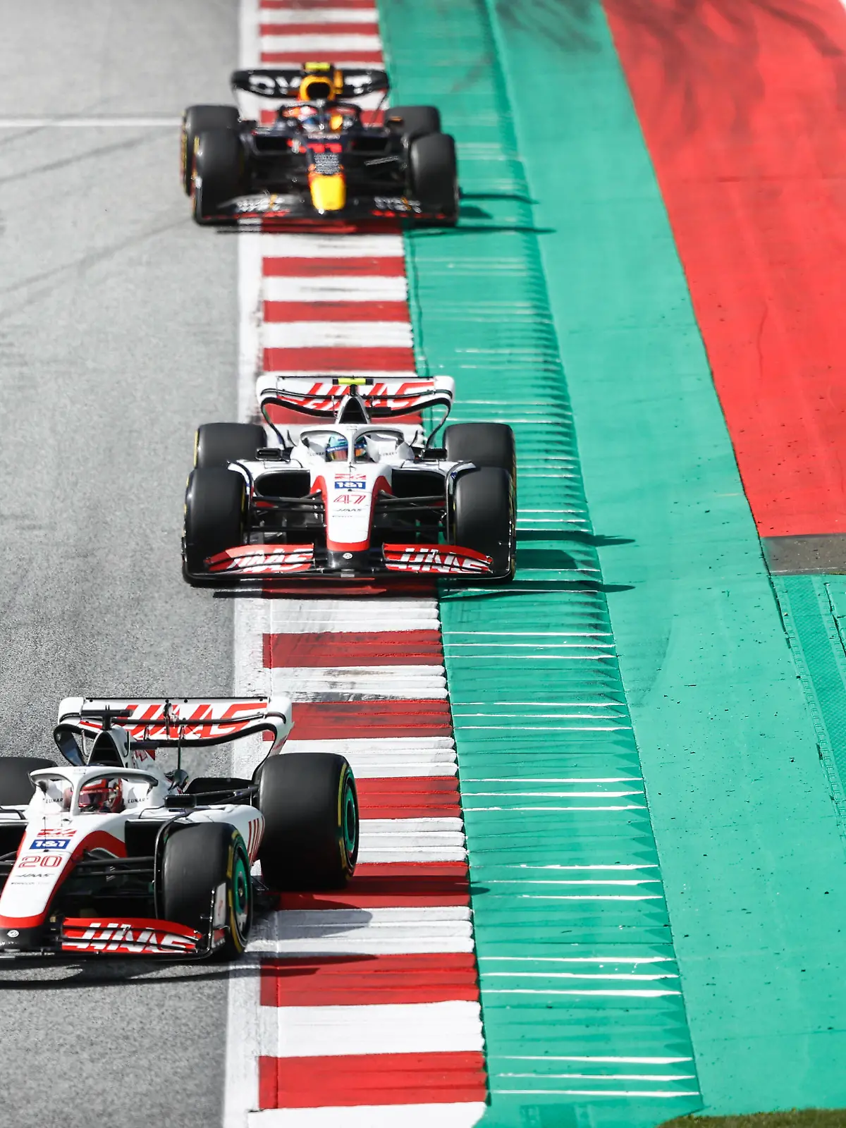 Formula 1 2022: Austrian GP RED BULL RING, AUSTRIA - JULY 09: Kevin Magnussen, Haas VF-22, leads Mick Schumacher, Haas VF-22, and Sergio Perez, Red Bull Racing RB18 during the Austrian GP at Red Bull Ring on Saturday July 09, 2022 in Spielberg, Austria. Photo by Andy Hone / LAT Images Images PUBLICATIONxINxGERxSUIxAUTxHUNxONLY GP2211_093656_ONY7060 