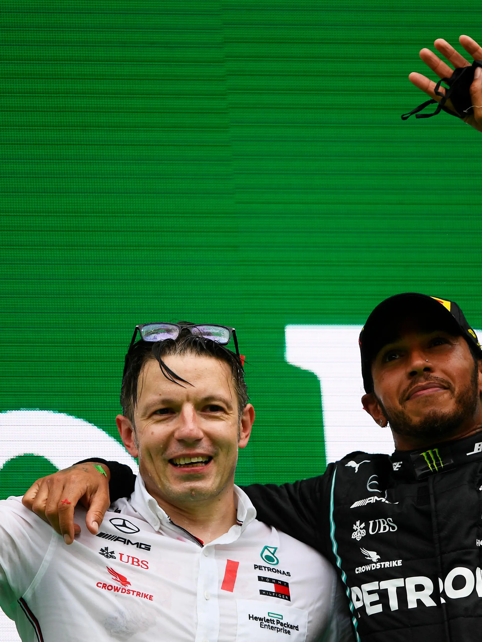 PORTIMAO, PORTUGAL - OCTOBER 25: Race winner Lewis Hamilton of Great Britain and Mercedes GP celebrates his record breaking 92nd race win with race engineer Peter Bonnington on the podium during the F1 Grand Prix of Portugal at Autodromo Internacional do Algarve on October 25, 2020 in Portimao, Portugal. (Photo by Rudy Carezzevoli/Getty Images)