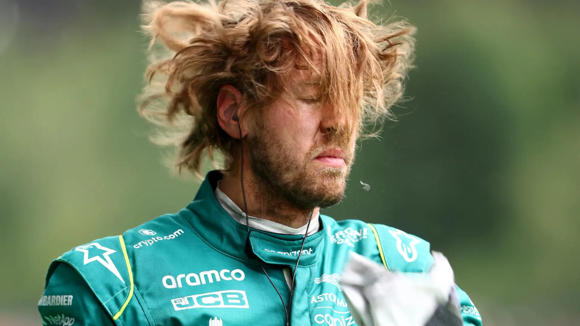 SPIELBERG, AUSTRIA - JULY 09: Sebastian Vettel of Germany and Aston Martin F1 Team walks in the Pitlane during practice ahead of the F1 Grand Prix of Austria at Red Bull Ring on July 09, 2022 in Spielberg, Austria. (Photo by Clive Rose/Getty Images)