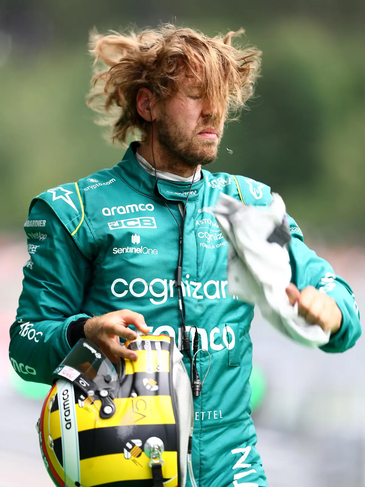 SPIELBERG, AUSTRIA - JULY 09: Sebastian Vettel of Germany and Aston Martin F1 Team walks in the Pitlane during practice ahead of the F1 Grand Prix of Austria at Red Bull Ring on July 09, 2022 in Spielberg, Austria. (Photo by Clive Rose/Getty Images)