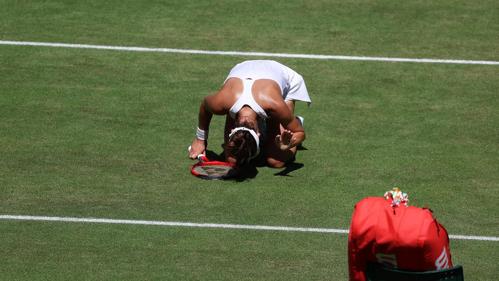 7th July 2022, All England Lawn Tennis and Croquet Club, London, England Wimbledon Tennis tournament Tatjana Maria GER on her knees in disappointment after her forehand shot hits the net to give Ons Jabeur TUN a vital game point PUBLICATIONxNOTxINxUK ActionPlus12405686 JohnxPatrickxFletcher 