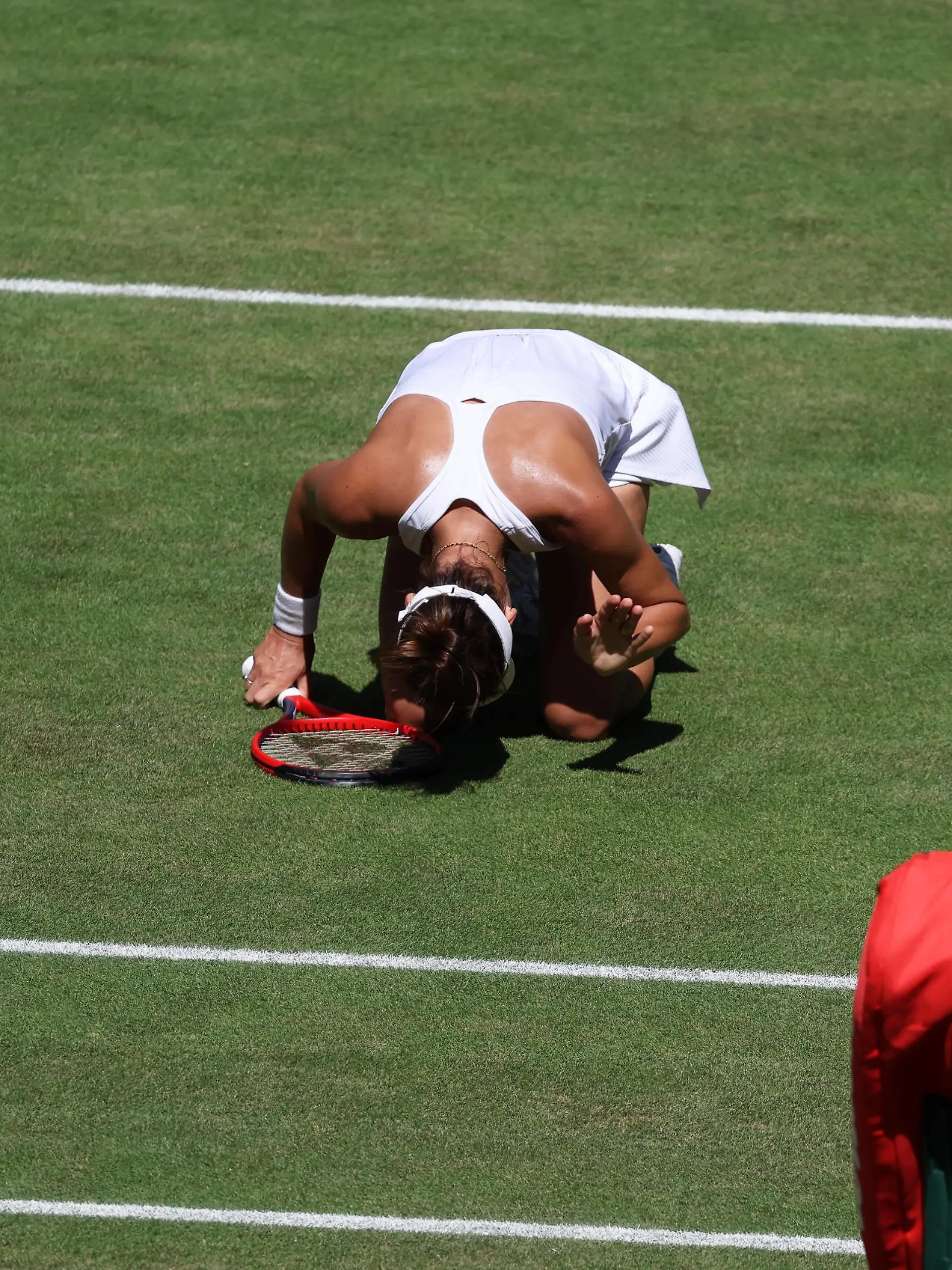 7th July 2022, All England Lawn Tennis and Croquet Club, London, England Wimbledon Tennis tournament Tatjana Maria GER on her knees in disappointment after her forehand shot hits the net to give Ons Jabeur TUN a vital game point PUBLICATIONxNOTxINxUK ActionPlus12405686 JohnxPatrickxFletcher 
