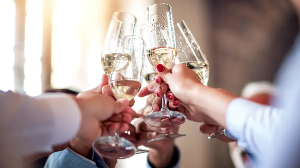 Close up image of business people toasting with champagne.