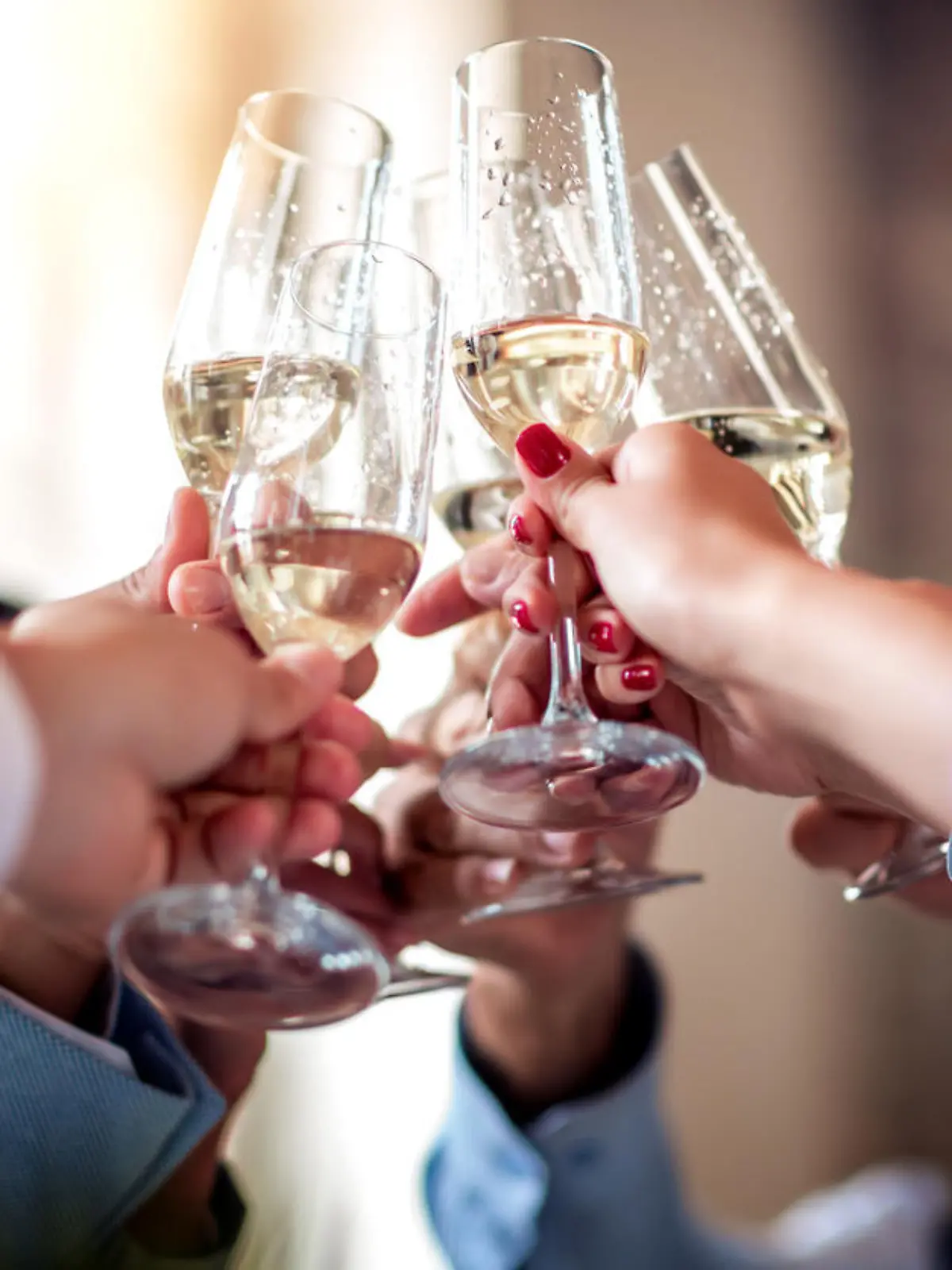 Close up image of business people toasting with champagne.