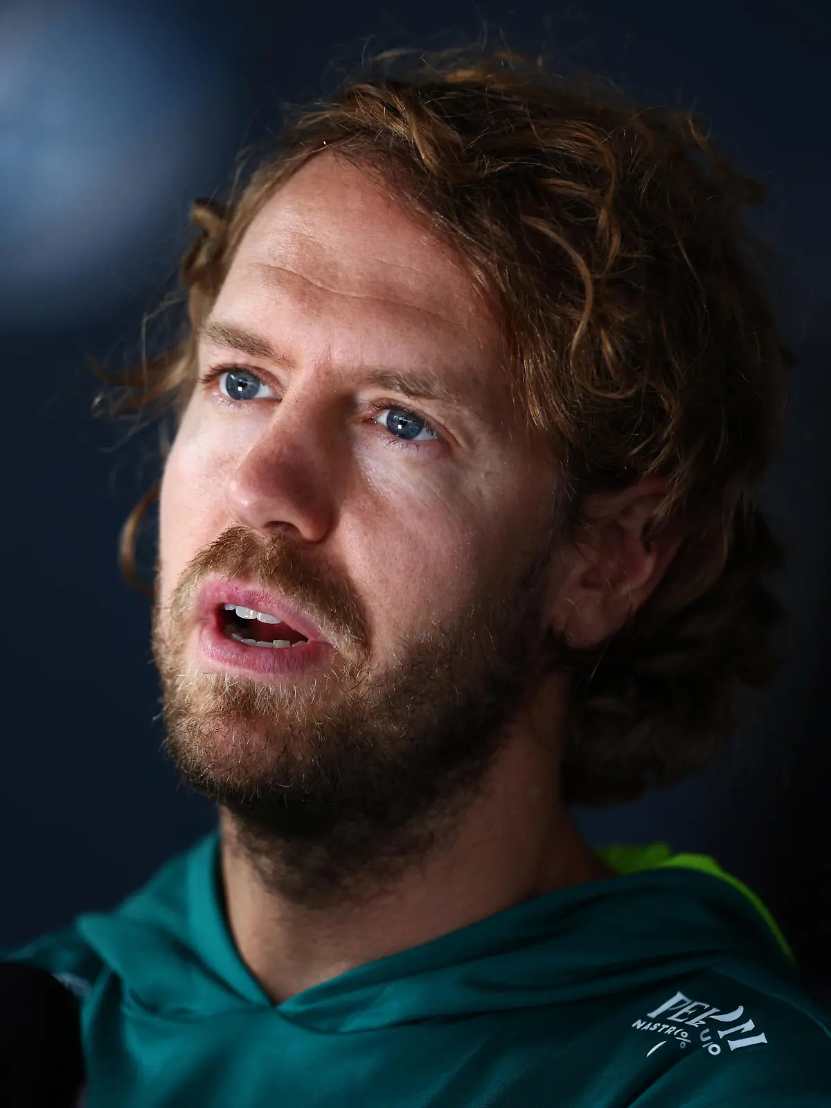 SPIELBERG, AUSTRIA - JULY 07: Sebastian Vettel of Germany and Aston Martin F1 Team talks to the media in the Paddock during previews ahead of the F1 Grand Prix of Austria at Red Bull Ring on July 07, 2022 in Spielberg, Austria. (Photo by Clive Rose/Getty Images)