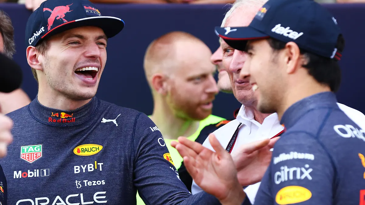BAKU, AZERBAIJAN - JUNE 12: Race winner Max Verstappen of the Netherlands and Oracle Red Bull Racing and Second placed Sergio Perez of Mexico and Oracle Red Bull Racing talk after the F1 Grand Prix of Azerbaijan at Baku City Circuit on June 12, 2022 in Baku, Azerbaijan. (Photo by Clive Rose/Getty Images)