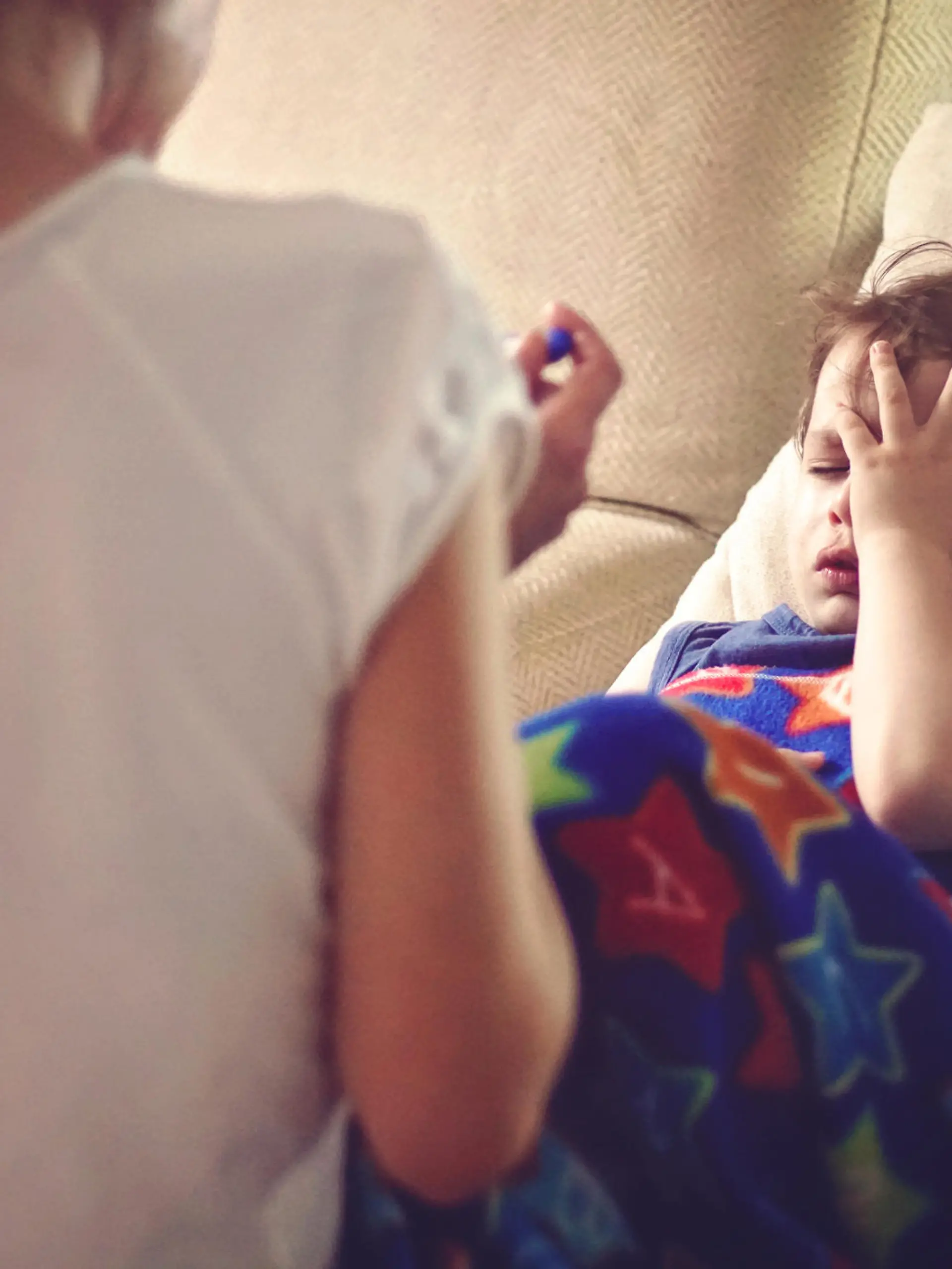 mother checking her sons temperature