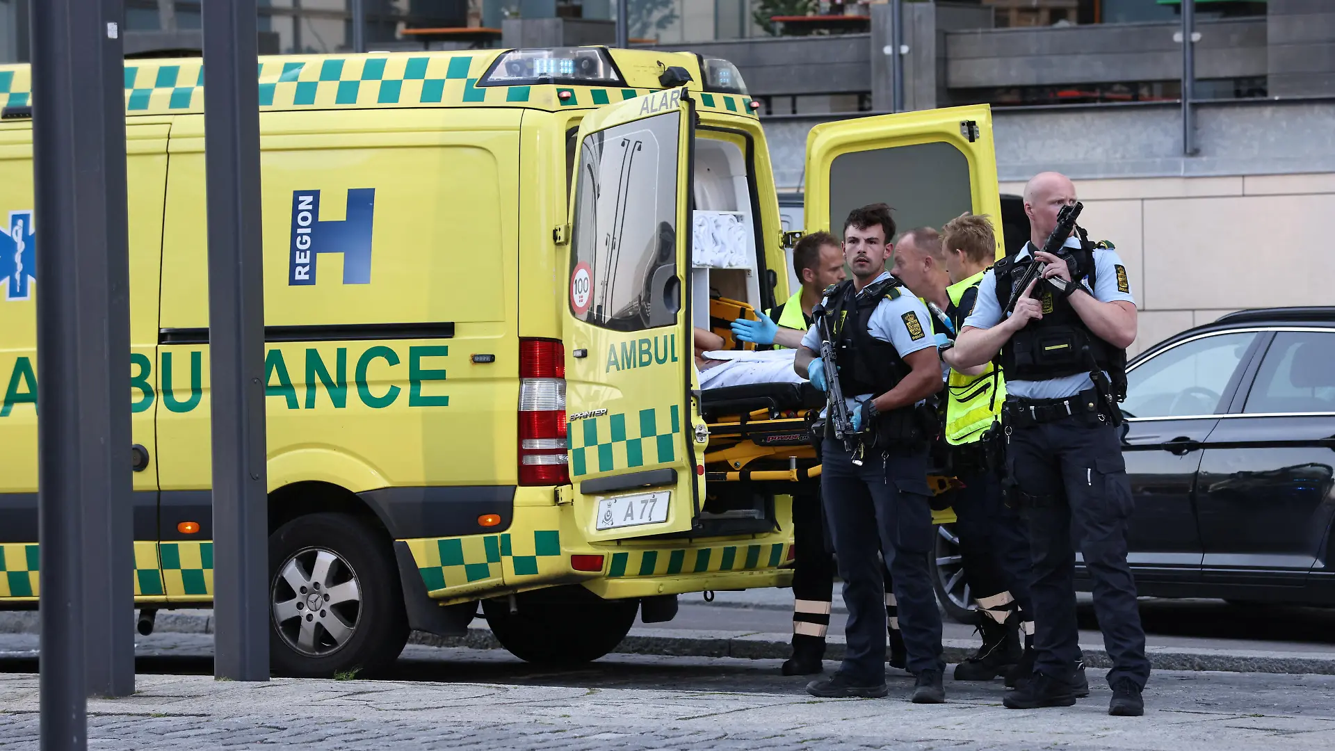 An ambulance and armed police stand outside Field's shopping centre, after Danish police said they received reports of shooting, in Copenhagen, Denmark, July 3, 2022. Ritzau Scanpix/Olafur Steinar Gestsson via REUTERS ATTENTION EDITORS - THIS IMAGE WAS PROVIDED BY A THIRD PARTY. DENMARK OUT. NO COMMERCIAL OR EDITORIAL SALES IN DENMARK.