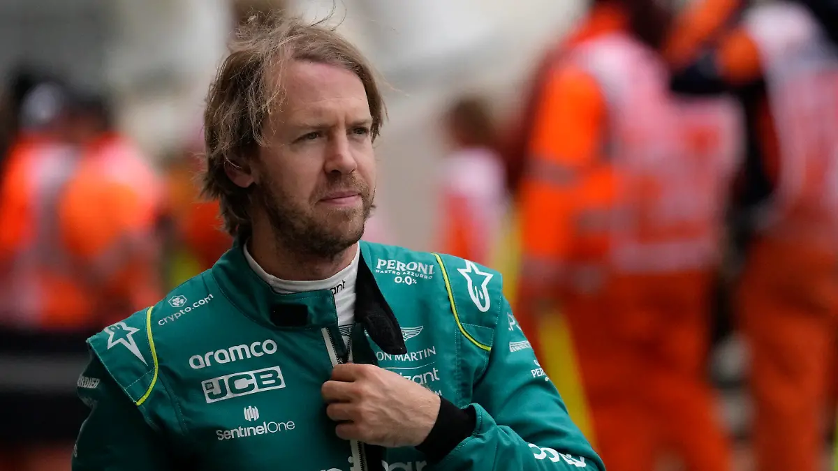 Aston Martin driver Sebastian Vettel of Germany walks after the third free practice at the Silverstone circuit, in Silverstone, England, Saturday, July 2, 2022. The British F1 Grand Prix is held on Sunday July 3, 2022. (AP Photo/Matt Dunham)