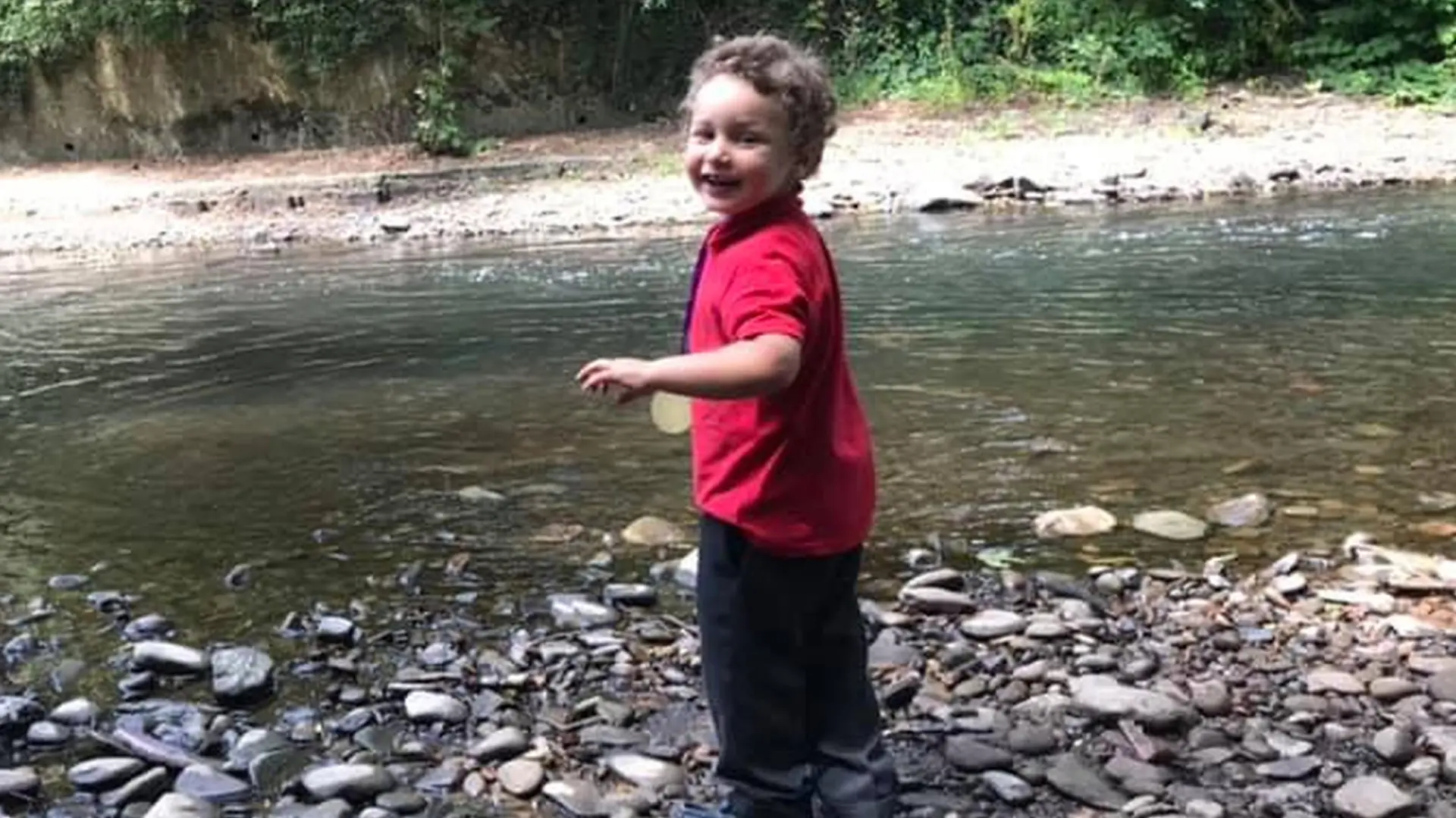 Pictured: The five year old who died in Ogmore river, named locally as Logan Williamson, pictured by Ogmore river on July 2019.
Re: South Wales Police can confirm that three people have been arrested following reports of concerns for a missing 5 year old boy in Sarn, Bridgend, and the subsequent finding of the body in the Ogmore River near Pandy Park, Bridgend, Wales, UK.
A 39 year male, 30 year female and 13 year old male, all from the Bridgend area, have been arrested on suspicion of murder and are currently in police custody. We are not looking for anyone else in relation to this incident.