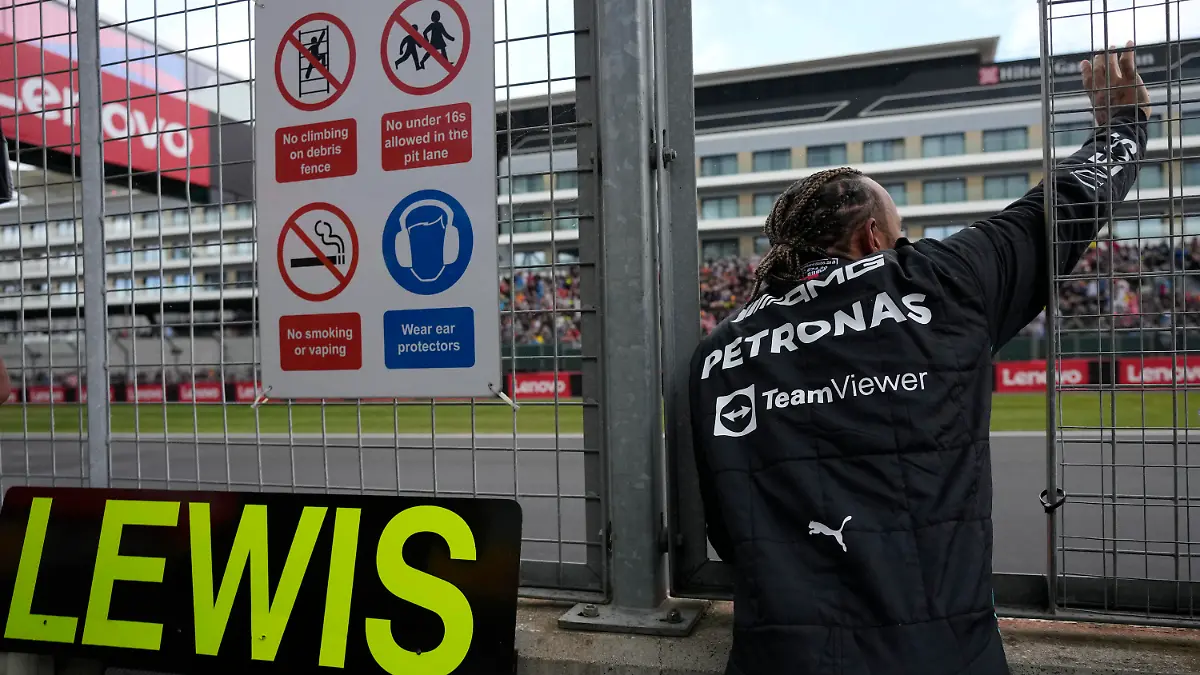 Mercedes driver Lewis Hamilton of Britain waves to fans during the first free practice at the Silverstone circuit, in Silverstone, England, Friday, July 1, 2022. The British F1 Grand Prix is held on Sunday July 3, 2022. (AP Photo/Matt Dunham)