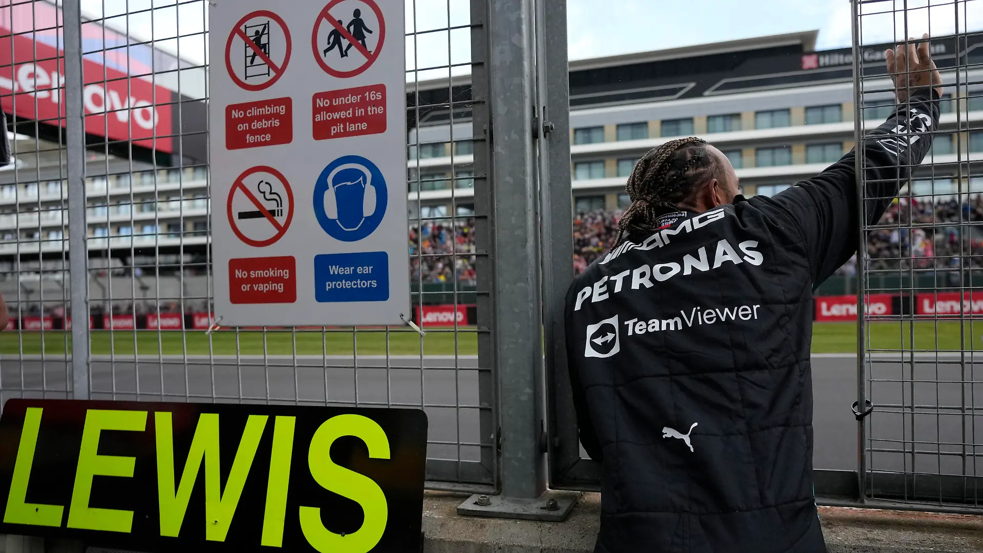 Mercedes driver Lewis Hamilton of Britain waves to fans during the first free practice at the Silverstone circuit, in Silverstone, England, Friday, July 1, 2022. The British F1 Grand Prix is held on Sunday July 3, 2022. (AP Photo/Matt Dunham)