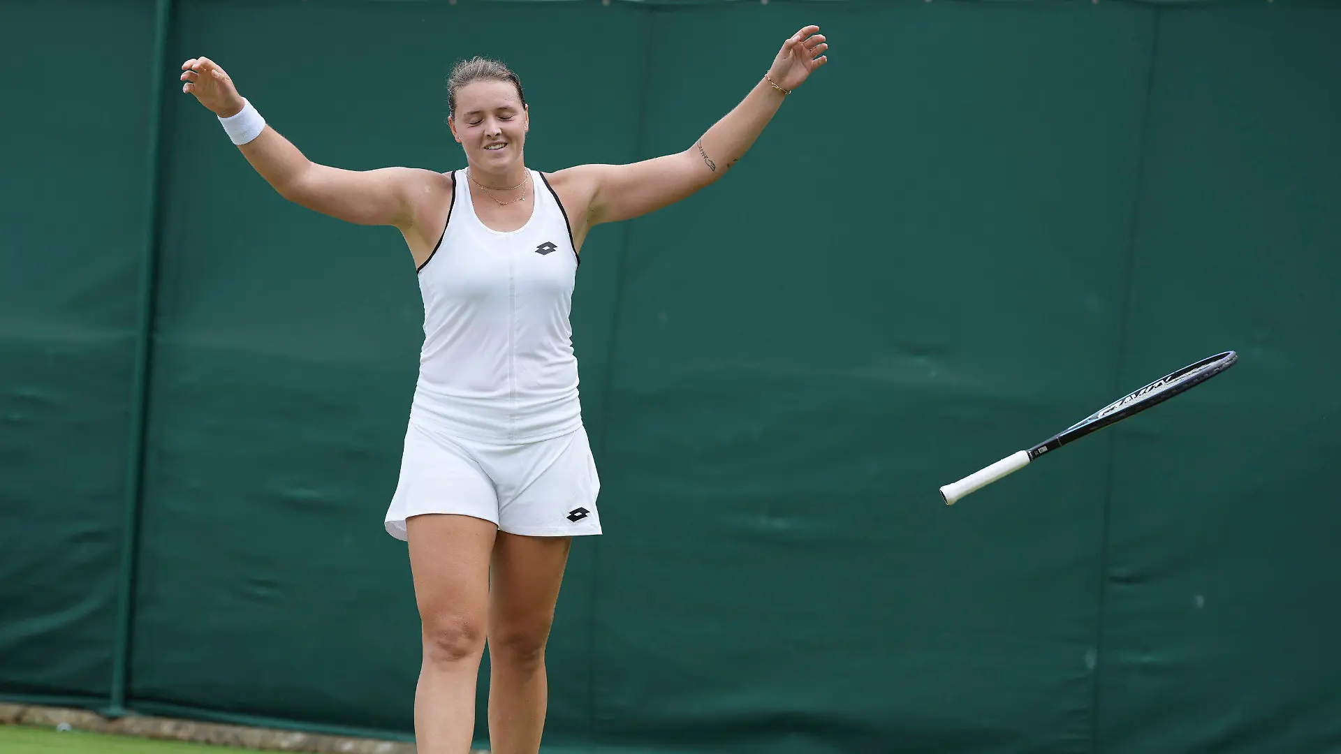 Germany's Jule Niemeier celebrates winning match point against Ukraine's Lesia Tsurenko in a third round women's singles match on day five of the Wimbledon tennis championships in London, Friday, July 1, 2022. (AP Photo/Alberto Pezzali)
