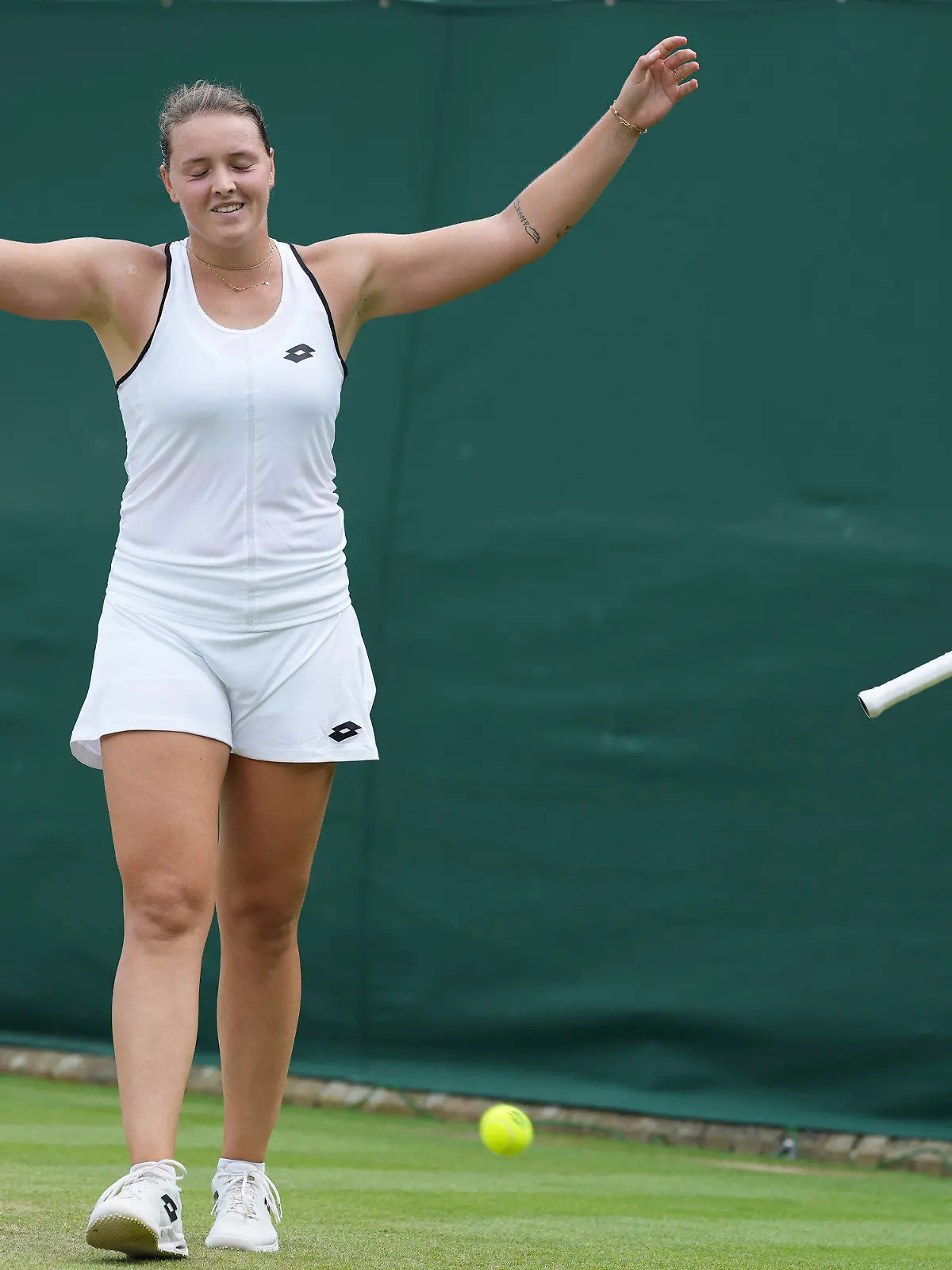Germany's Jule Niemeier celebrates winning match point against Ukraine's Lesia Tsurenko in a third round women's singles match on day five of the Wimbledon tennis championships in London, Friday, July 1, 2022. (AP Photo/Alberto Pezzali)