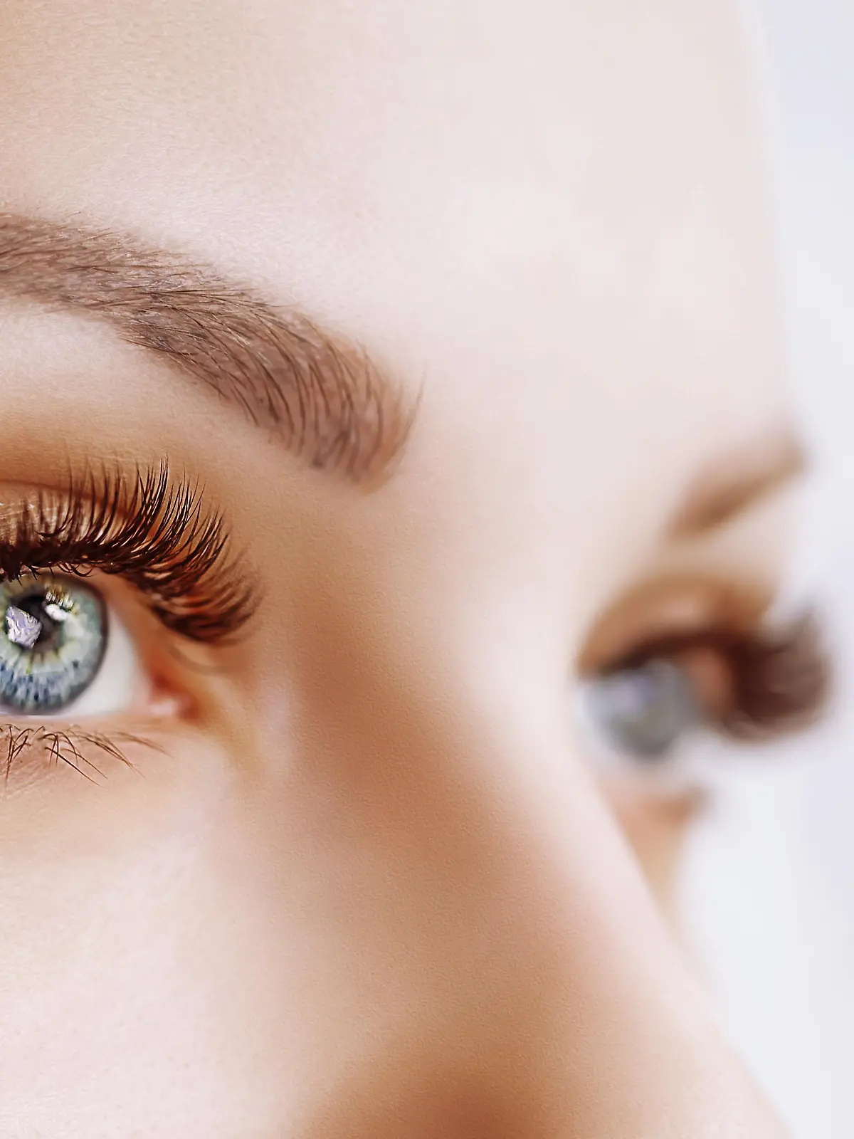 Eyelash Extension Procedure. Woman Eye with Long Eyelashes. Lashes. Close up, macro, selective focus