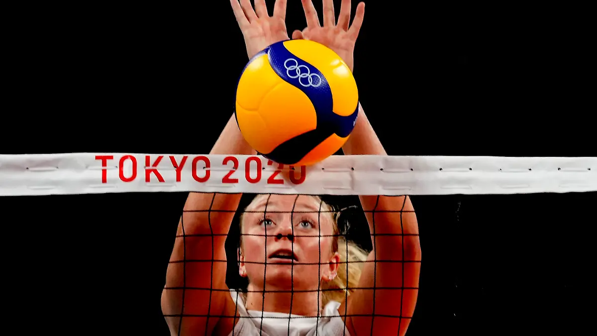 FILE - United States' Jordyn Poulter blocks the ball during the women's volleyball preliminary round at the 2020 Summer Olympics, July 27, 2021, in Tokyo. A stolen Olympic gold medal belonging to Poulter has been found in Southern California, authorities said Wednesday, June 29. Poulter reported the medal stolen May 25 after the Olympian discovered her car broken into at a parking garage in Anaheim, Calif., police said. (AP Photo/Frank Augstein,File)
