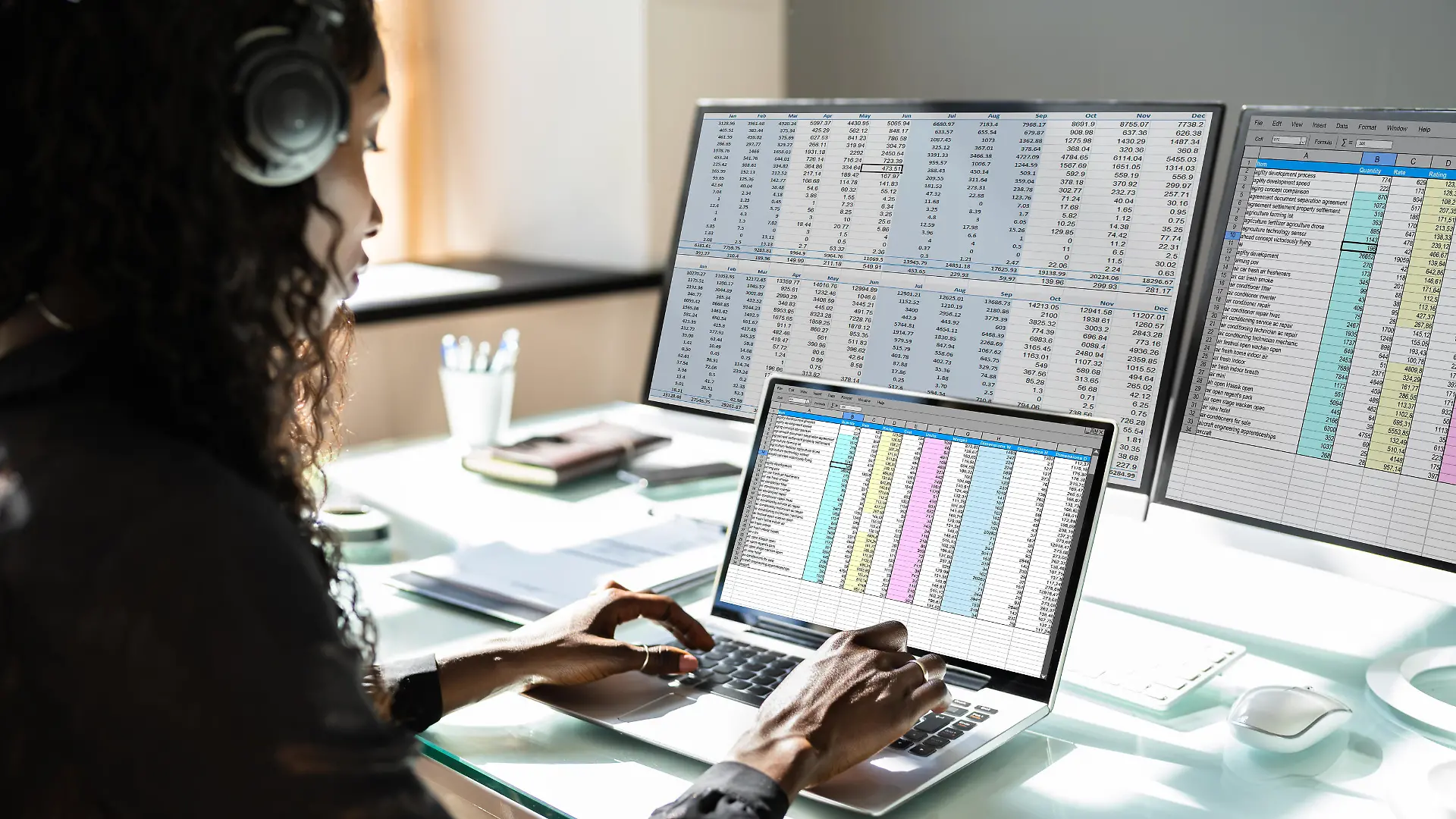Data Analyst African Woman Using Spreadsheet On Computer