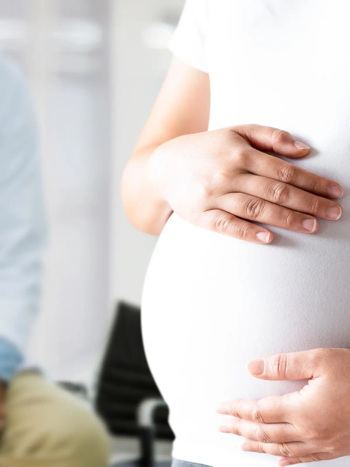 Happy pregnant woman visit gynecologist doctor at hospital or medical clinic for pregnancy consultant. Doctor examine pregnant belly for baby and mother healthcare check up. Gynecology concept.