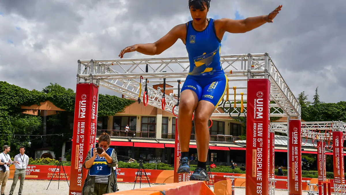 In this photo provided by the Turkish Modern Pentathlon Federation, an athlete competes during the UIPM World Pentathlon New 5th Discipline Test event in Ankara, Tuesday, June 28, 2022. (Turkish Modern Pentathlon Federation via AP)