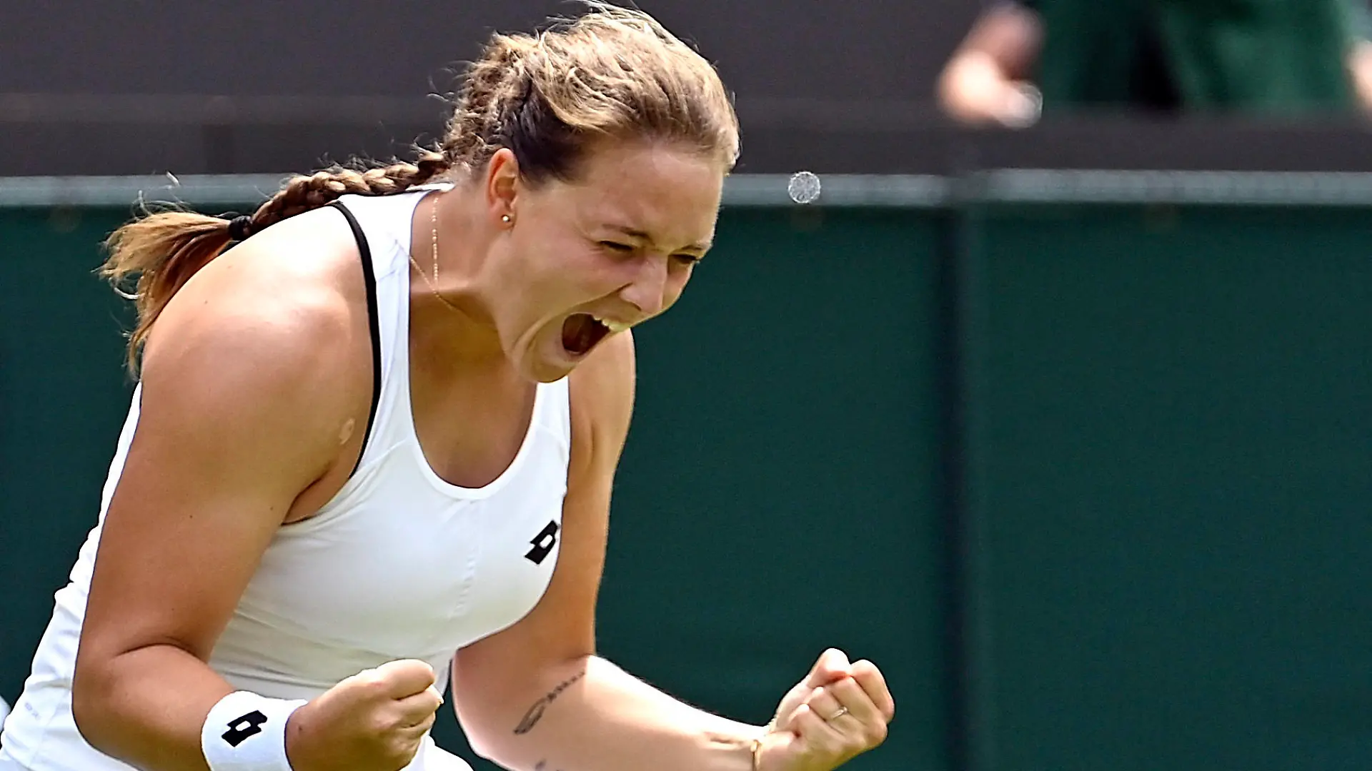 Tennis - Wimbledon - All England Lawn Tennis and Croquet Club, London, Britain - June 29, 2022 Germany's Jule Niemeier celebrates winning her second round match against Estonia's Anett Kontaveit REUTERS/Toby Melville