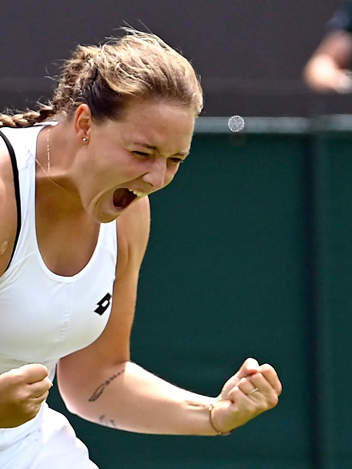 Tennis - Wimbledon - All England Lawn Tennis and Croquet Club, London, Britain - June 29, 2022 Germany's Jule Niemeier celebrates winning her second round match against Estonia's Anett Kontaveit REUTERS/Toby Melville