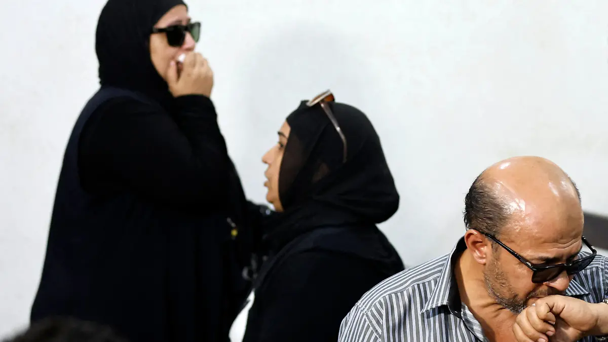 The parents and a family member of murdered university of Mansoura student Naira Ashraf, attend the first trial session of the presumed murderer Mohamed Adel, at the Mansoura courthouse, some 145km north of the capital Cairo, on June 26, 2022. (Photo by Khaled DESOUKI / AFP) (Photo by KHALED DESOUKI/AFP via Getty Images)