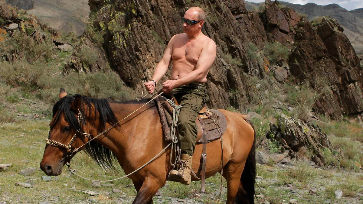 FILE - In this file pool photo taken on Monday, Aug. 3, 2009, the then Russian Prime Minister Vladimir Putin ia seen riding a horse while traveling in the mountains of the Siberian Tyva region (also referred to as Tuva), Russia, during his short vacation. After 18 years as Russia’s leader _ and with another six-year term sure to follow a March election _ Putin doesn’t show the appetites or vulnerabilities that can personalize Western politics, even when staged or spun. If he has moments of merriment or melancholy, they happen in private. (Alexei Druzhinin, Sputnik, Kremlin Pool Photo via AP, file)