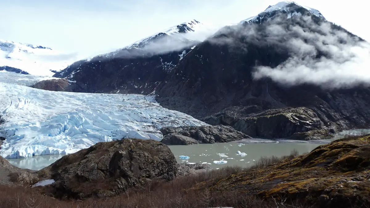 FILE - Chunks of ice float in Mendenhall Lake in front of the Mendenhall Glacier on April 29, 2023, in Juneau, Alaska. An Alaska man inadvertently filmed his own drowning on the glacial lake with a GoPro camera mounted on his helmet, but authorities who recovered the camera have not yet found his body, officials said Tuesday, July 18, 2023. (AP Photo/Becky Bohrer, File)