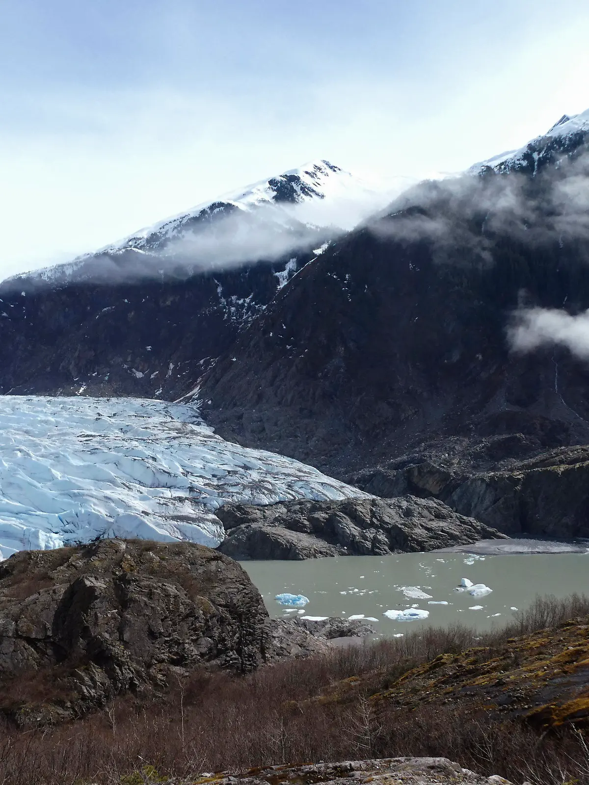 FILE - Chunks of ice float in Mendenhall Lake in front of the Mendenhall Glacier on April 29, 2023, in Juneau, Alaska. An Alaska man inadvertently filmed his own drowning on the glacial lake with a GoPro camera mounted on his helmet, but authorities who recovered the camera have not yet found his body, officials said Tuesday, July 18, 2023. (AP Photo/Becky Bohrer, File)