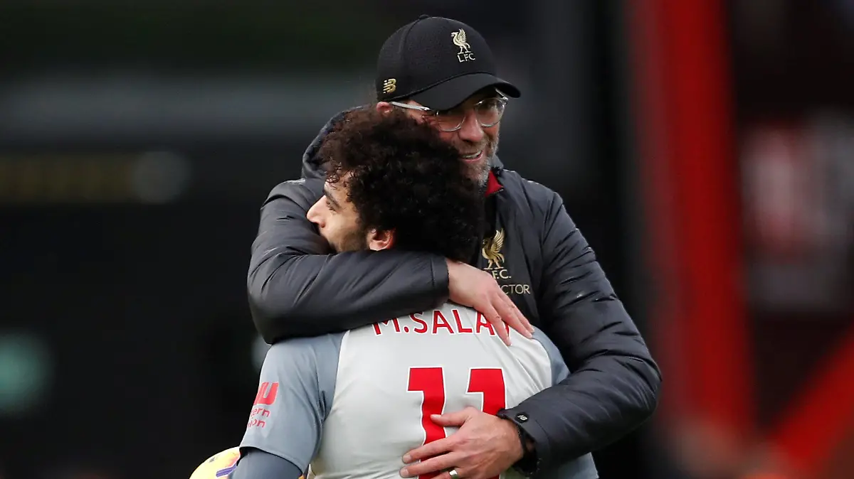 Soccer Football - Premier League - AFC Bournemouth v Liverpool - Vitality Stadium, Bournemouth, Britain - December 8, 2018  Liverpool manager Juergen Klopp celebrates after the match with Mohamed Salah   Action Images via Reuters/Matthew Childs  EDITORIAL USE ONLY. No use with unauthorized audio, video, data, fixture lists, club/league logos or "live" services. Online in-match use limited to 75 images, no video emulation. No use in betting, games or single club/league/player publications.  Please contact your account representative for further details.