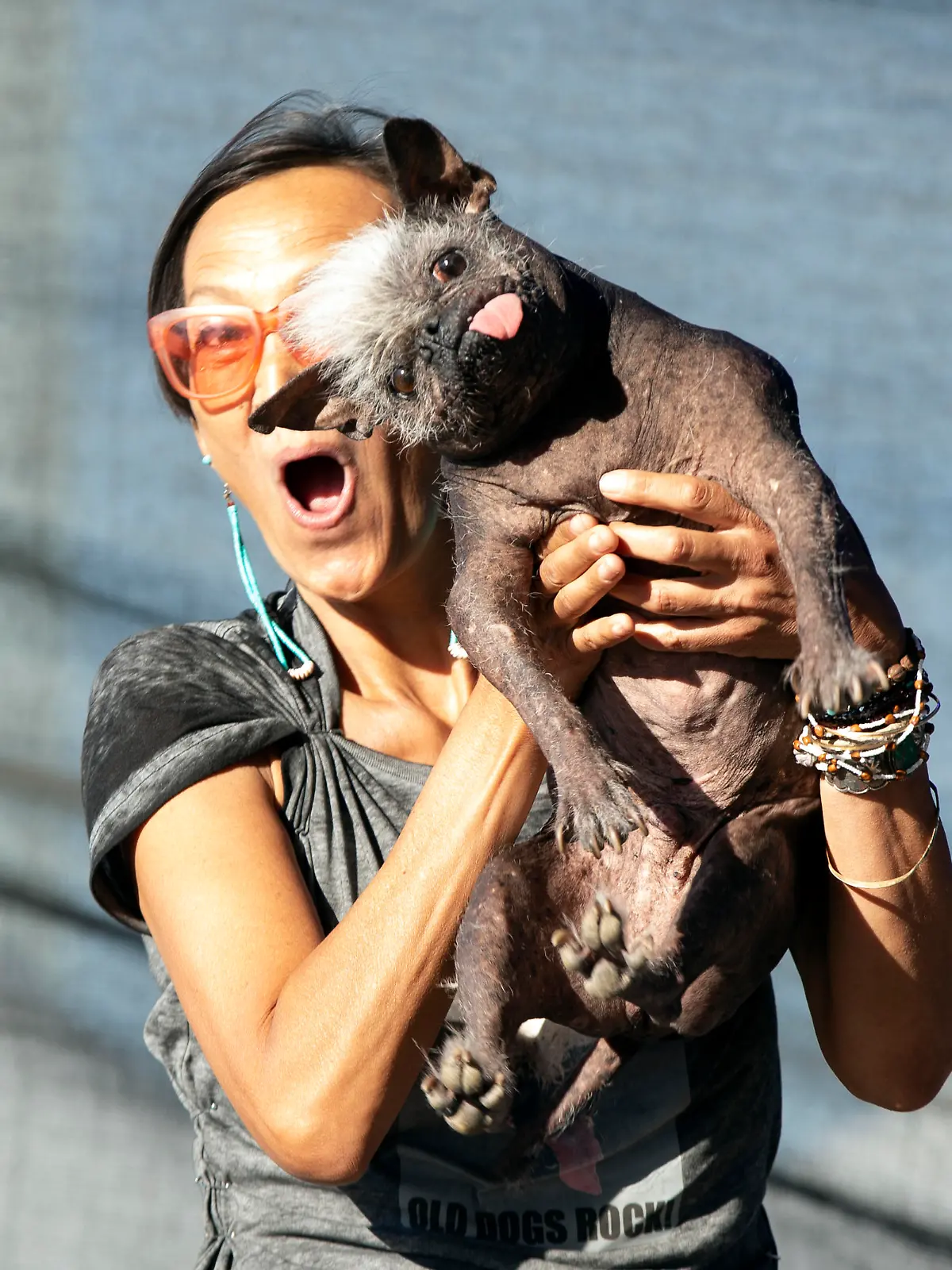 Jeneda Benally of Flagstaff, Ariz. poses for a photo with her dog Mr. Happy Face, the winner of the 2022 World's Ugliest Dog competition, Friday, June 24, 2022, in Petaluma, Calif. (AP Photo/D. Ross Cameron)