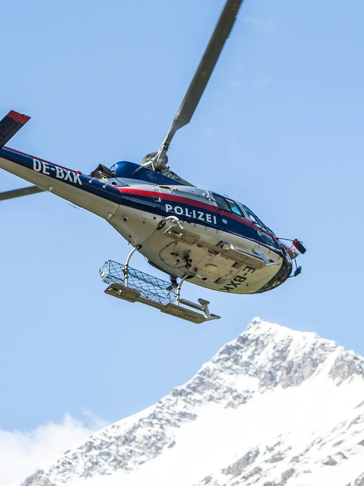 14.05.2013, Tauernhaus, Matrei i.O., AUT, Felbertauernstrasse nach Hangrutsch gesperrt, im Bild der Polizei Hubschrauber Libelle Tirol. In der Nacht von 13. auf 14. Mai kam es auf der Felbertauernstrasse auf Hohe der SChildalmgalerie zu einen Hangrutsch bzw. Felssturz auf einer Laenge von von ca. 100 Metern. Die Strasse ist fuer den gesamten Verkehr bis auf weiteres gesperrt. Es wird vermutet das ein KFZ unter den Schuttmassen verschuettet ist. EXPA Pictures © 2013, PhotoCredit: EXPA/ Juergen Feichter - 20130514_PD1085