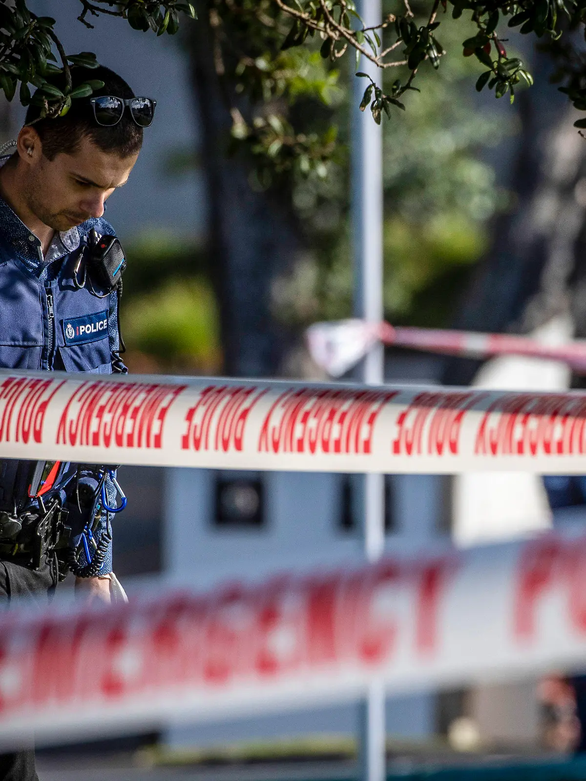Police set up a cordon and search area in a suburb of Auckland following reports of multiple stabbings, in New Zealand, Thursday, June 23, 2022. Authorities say a man wounded some people in a stabbing rampage in a New Zealand city before bystanders brought him to the ground. (Michael Craig/New Zealand Herald via AP)