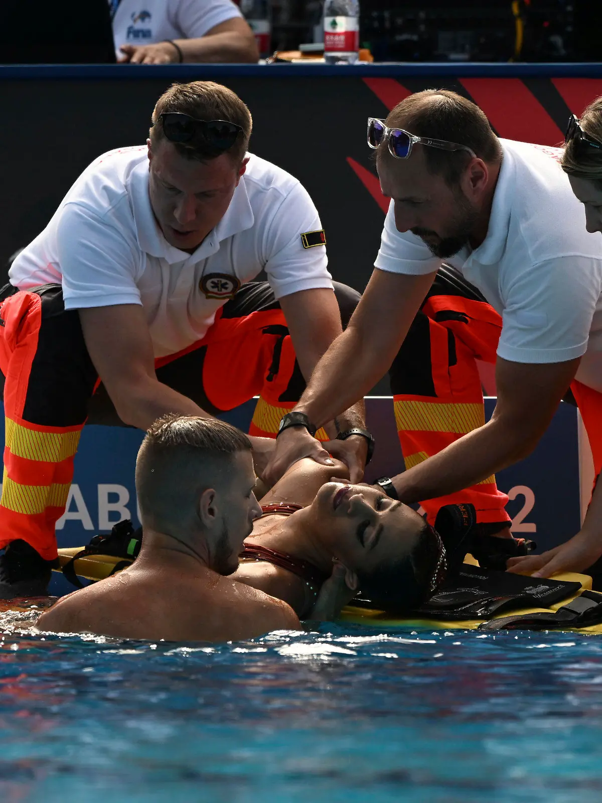 Anita Alvarez of United States is taken from the pool after collapsing during the solo free final of the artistic swimming at the 19th FINA World Championships in Budapest, Hungary, Wednesday, June 22, 2022. (AP Photo/Anna Szilagyi)
